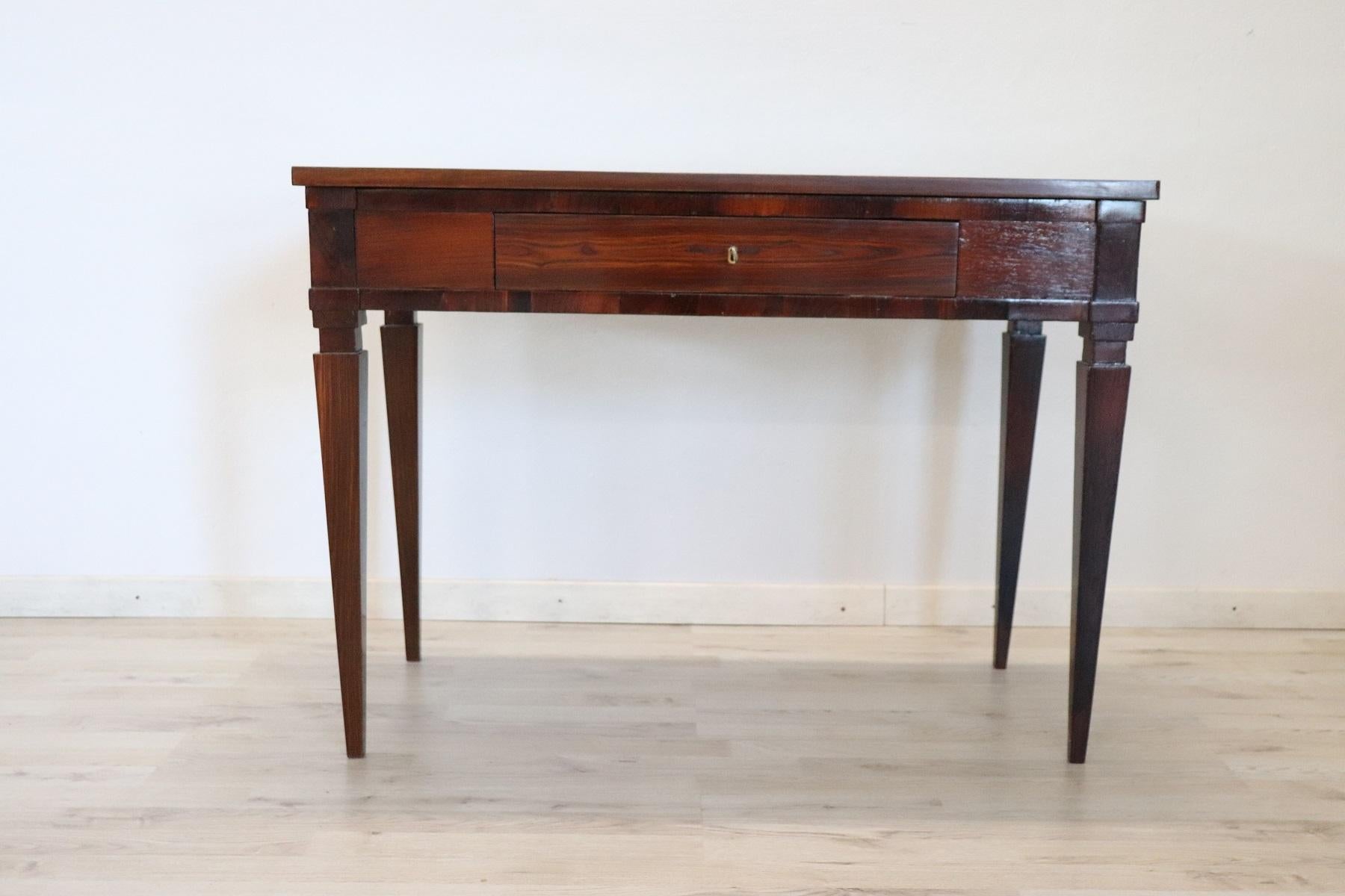 Elegant and essential antique Italian writing desk. Louis XVI period with Classic spiked legs. Present one drawer on the front. Rare and precious rosewood.
Perfect condition restored in the professional laboratory.