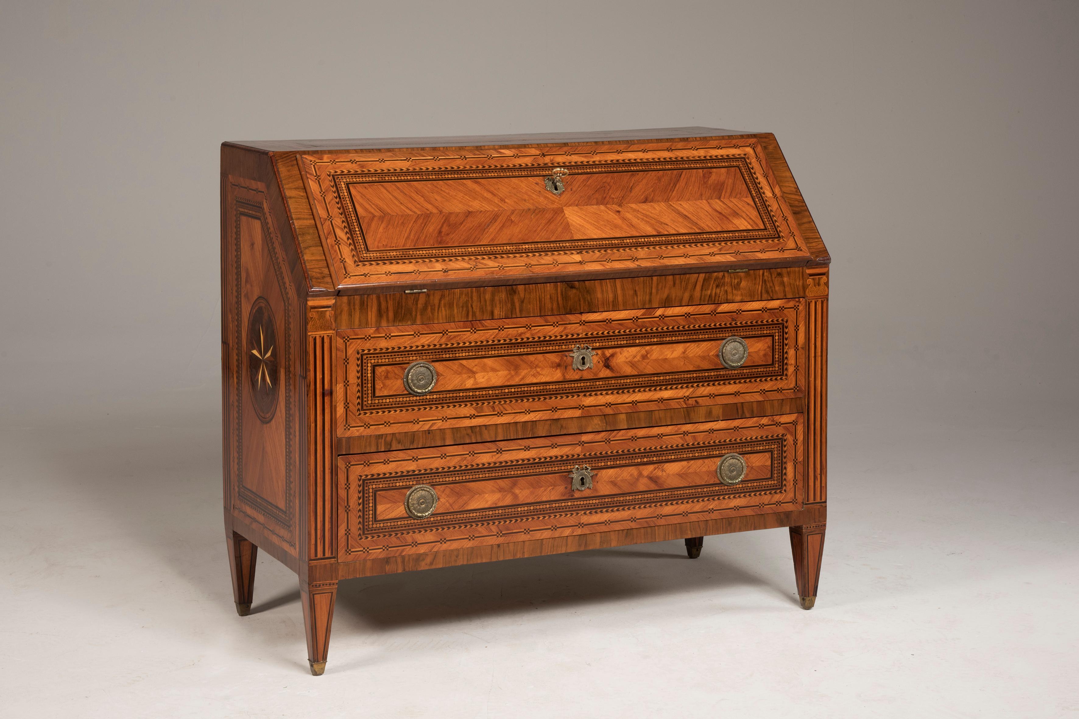 Louis XVI late 18th century Bureau. From Italy from Lombardy region. It features two drawers with coeval rounded handles, as the rest of the hardware. Behind the tilt door it features a leather covered writing surface and four small drawers.