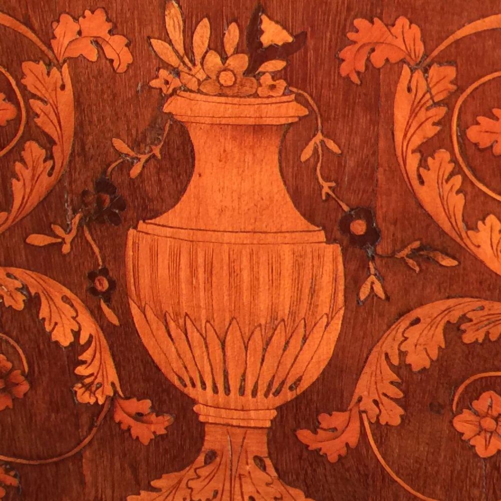 An Italian Maggiolini marquetry petite commode, or comodino, circa 1790.
Stamped ‘Casa Offredi’ to the underside.
A small late 18th century walnut, fruitwood and palissander, neoclassical inlaid commode in the manner of Guiseppe Maggiolini, Milan