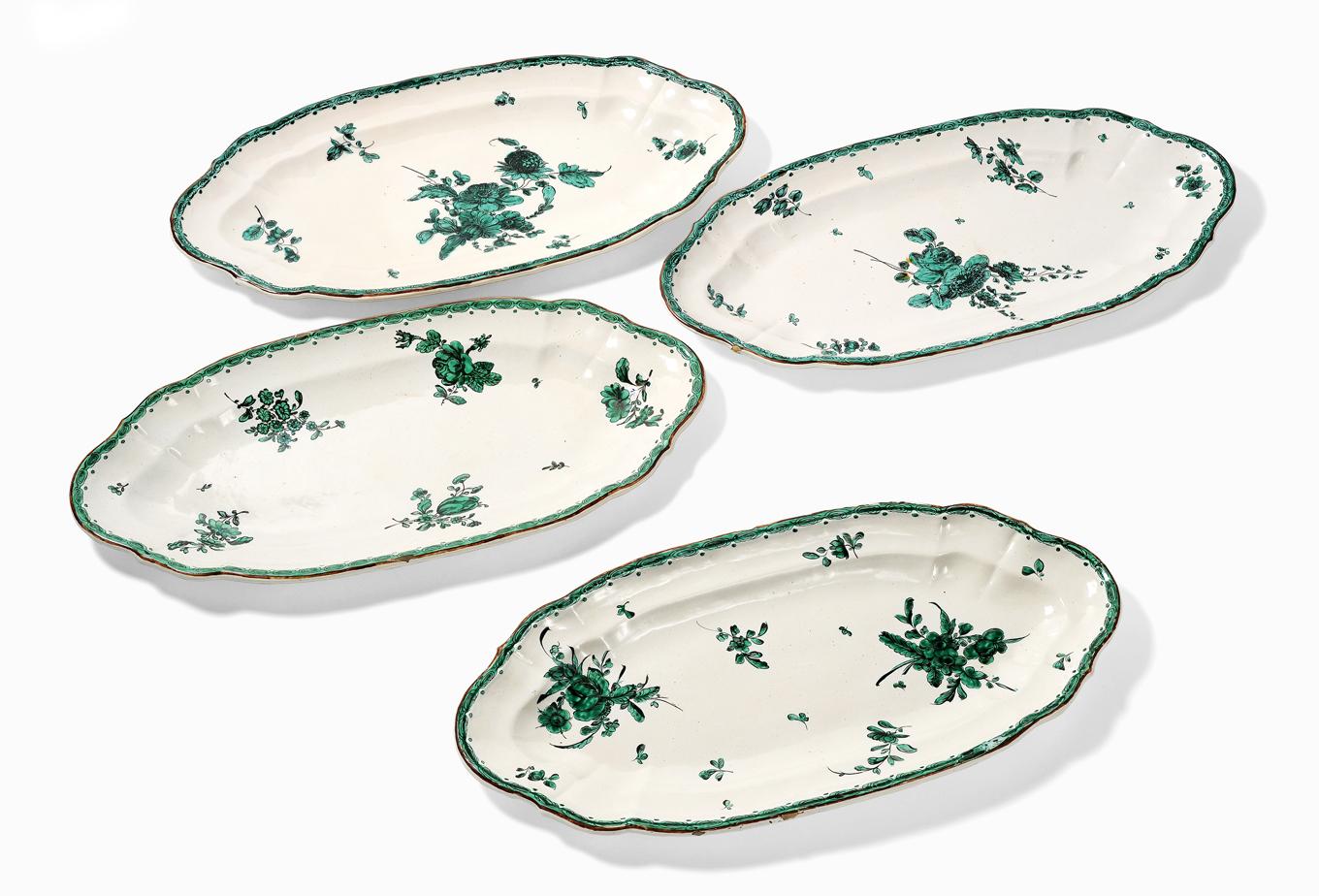 Assortment of 21 maiolica service elements
Pasquale Rubati Factory
Milan, 1780 circa 

a.	Four large oval dishes or fish dishes 10.43 in x 21.25 in (26.5 cm x 54 cm)
b.	Nine round dishes 9.25 in (23.5 cm) diameter
c.	Two oval mixtilinear edge dishes