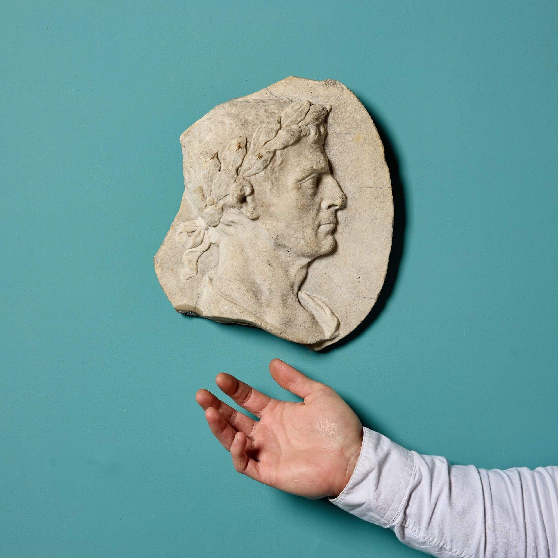 A weathered late 18th century Italian white statuary marble plaque of a Roman emperor, possibly Julius Caesar, circa 1780.

At over 240 years old, this plaque resembles an old, ancient fragment, with losses and weathering as if it has been plucked