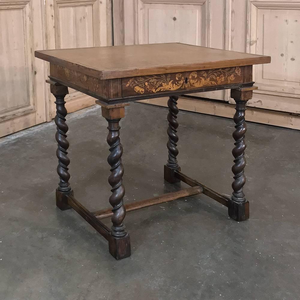 18th century Italian marquetry barley twist table is a marvel of master craftsmanship, with intricate marquetry on the apron depicting floral sprays barley twist legs with a ridge in the trough provide support, with a classic 