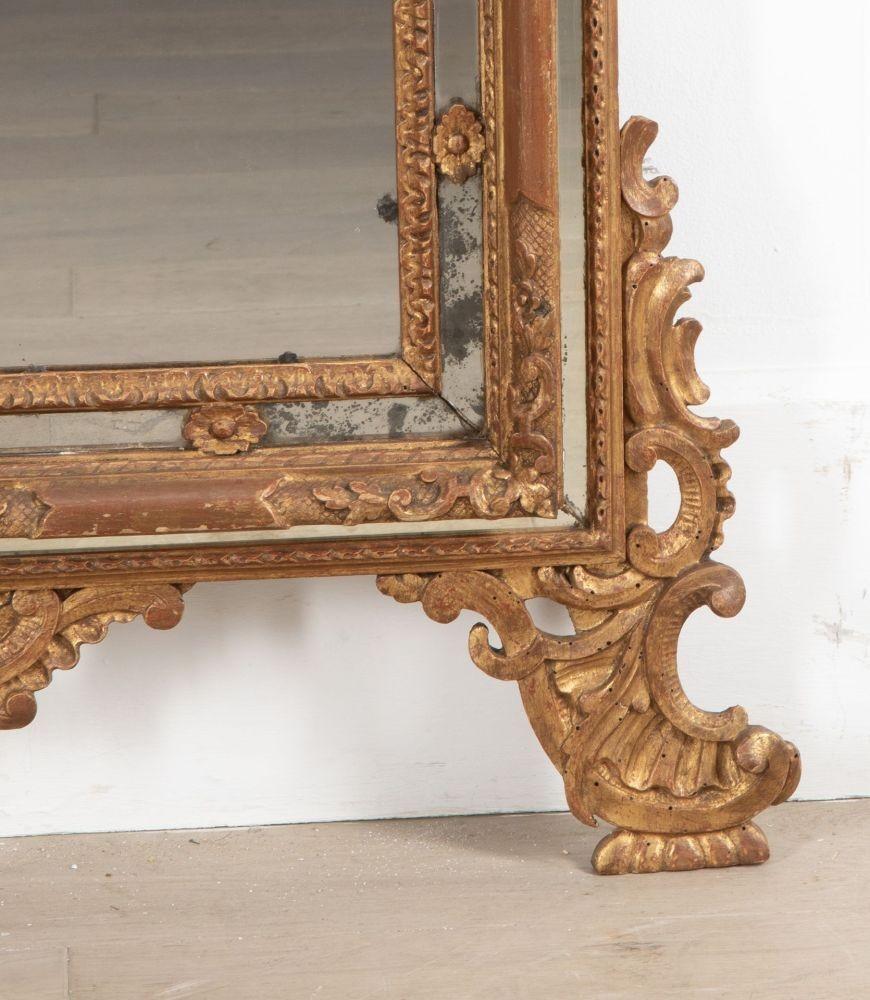 A fabulous bright gilt 18th Century Italian mirror within a bordered glass frame.
This mirror has had some minor restoration, commensurate with age.
Circa 1790.
