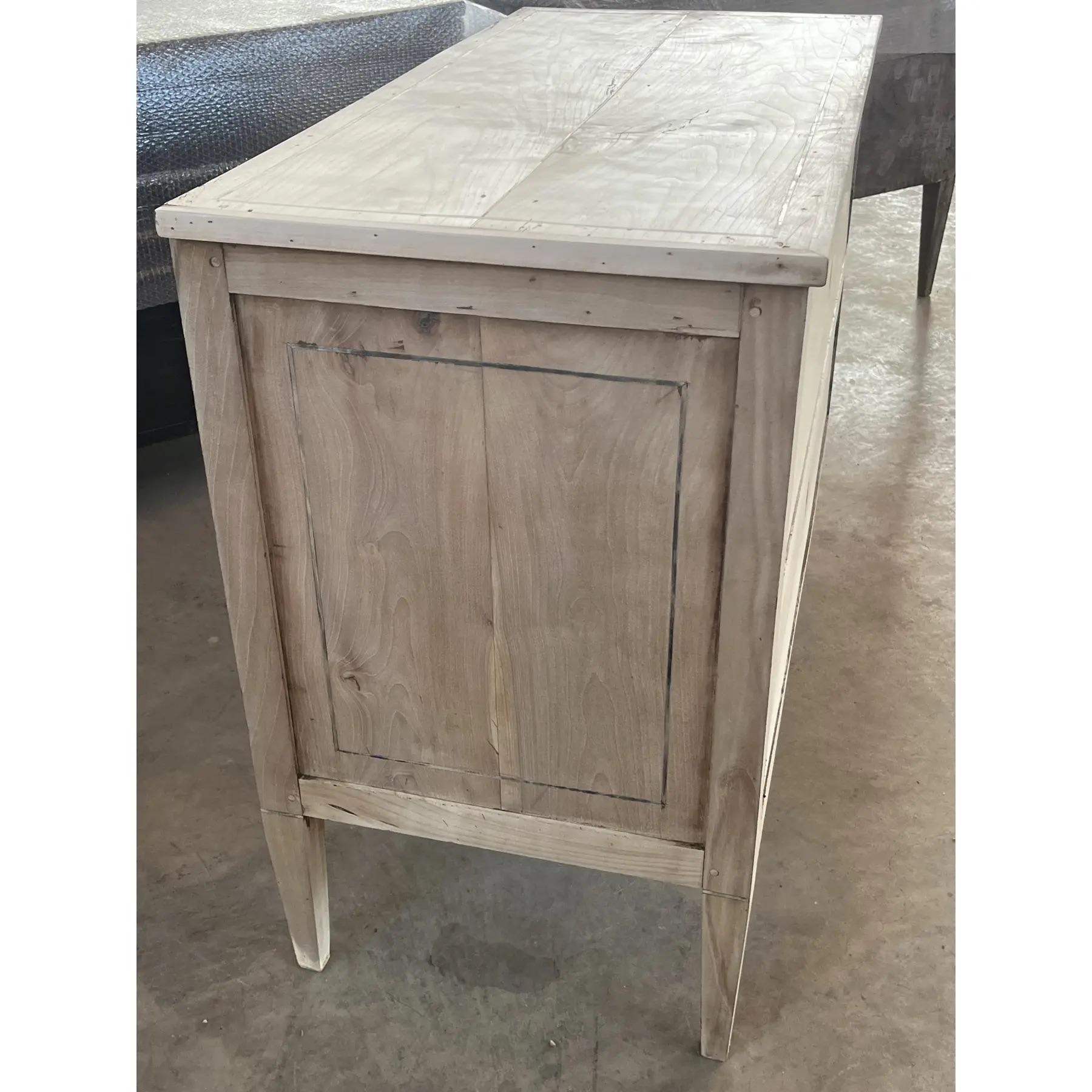 Neoclassical commode hand-made in Italy in the late 1700s using cherry and walnut for inlay. The commode features two large inset drawers with hand-made dovetail joints and decorated by a simple inlaid walnut veneer line. The top is made of two