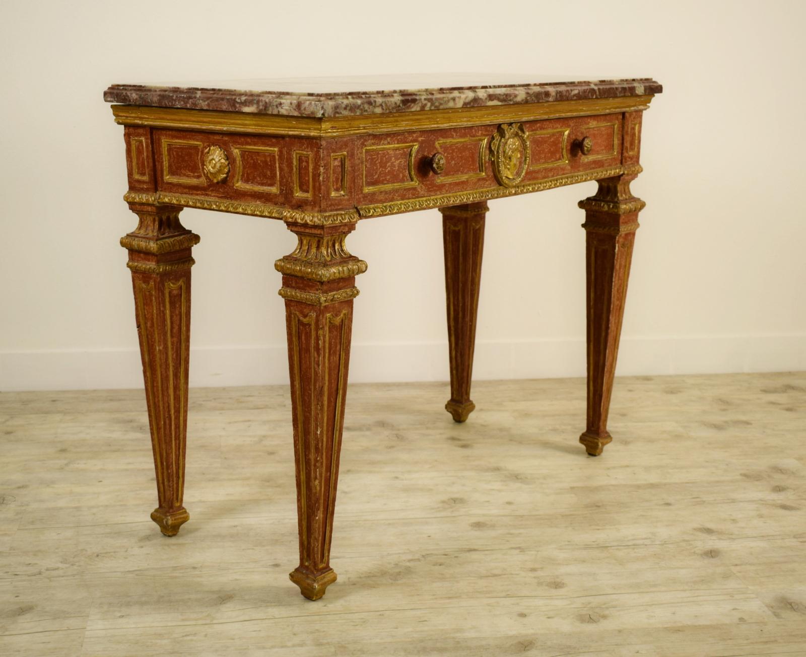 18th century, Italian neoclassical gilded and red lacquered wood with marble top
Piedmont, Italy, second half of the 18th century

This fine piedmontese console table (northern Italy) is made of hand carved wood, richly gilded with red lacquered