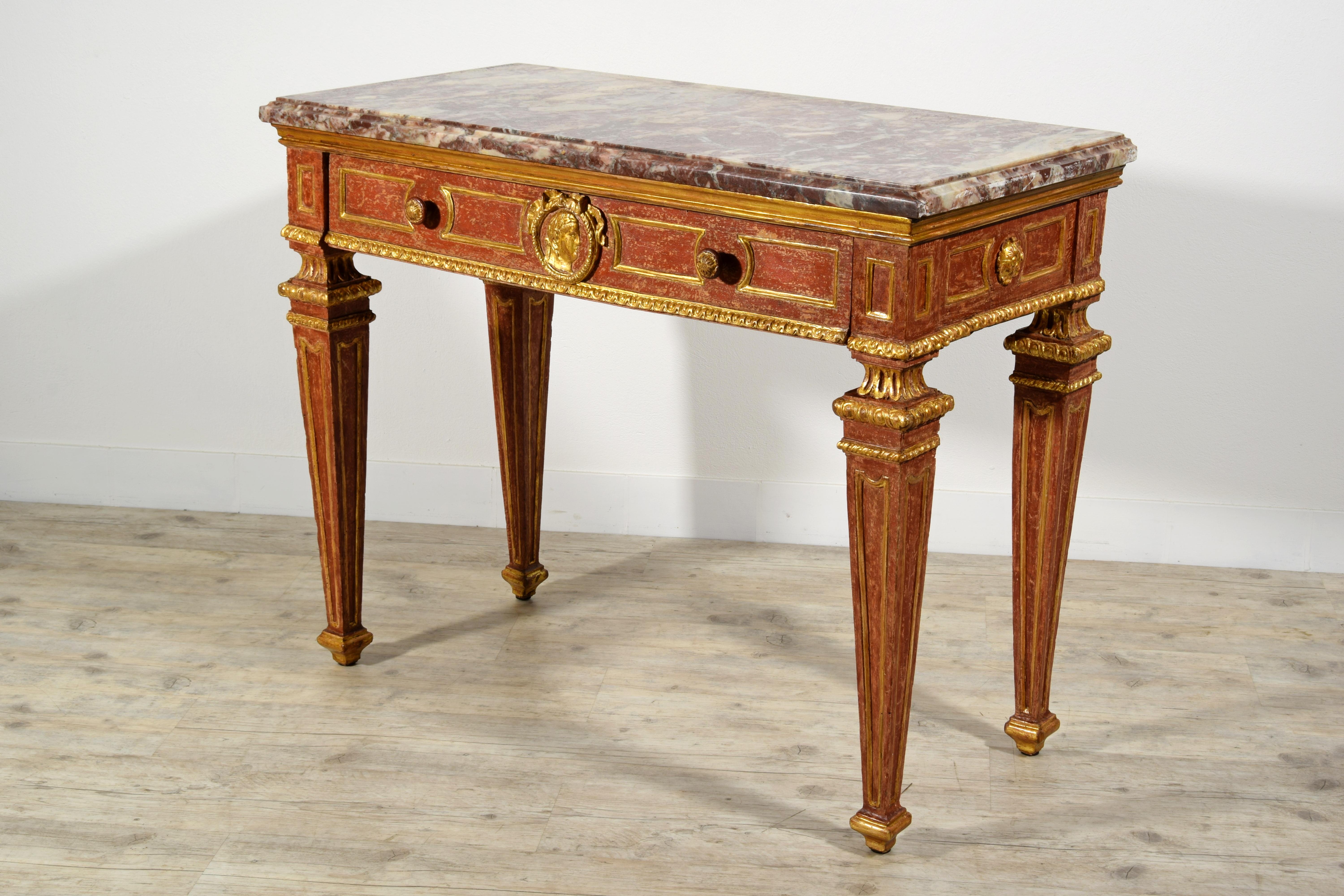 18th Century, Italian neoclassical gilded and red lacquered wood with marble top
Piedmont, Italy, second half of the 18th century.

This fine piedmontese console table (northern Italy) is made of hand carved wood, richly gilded with red lacquered