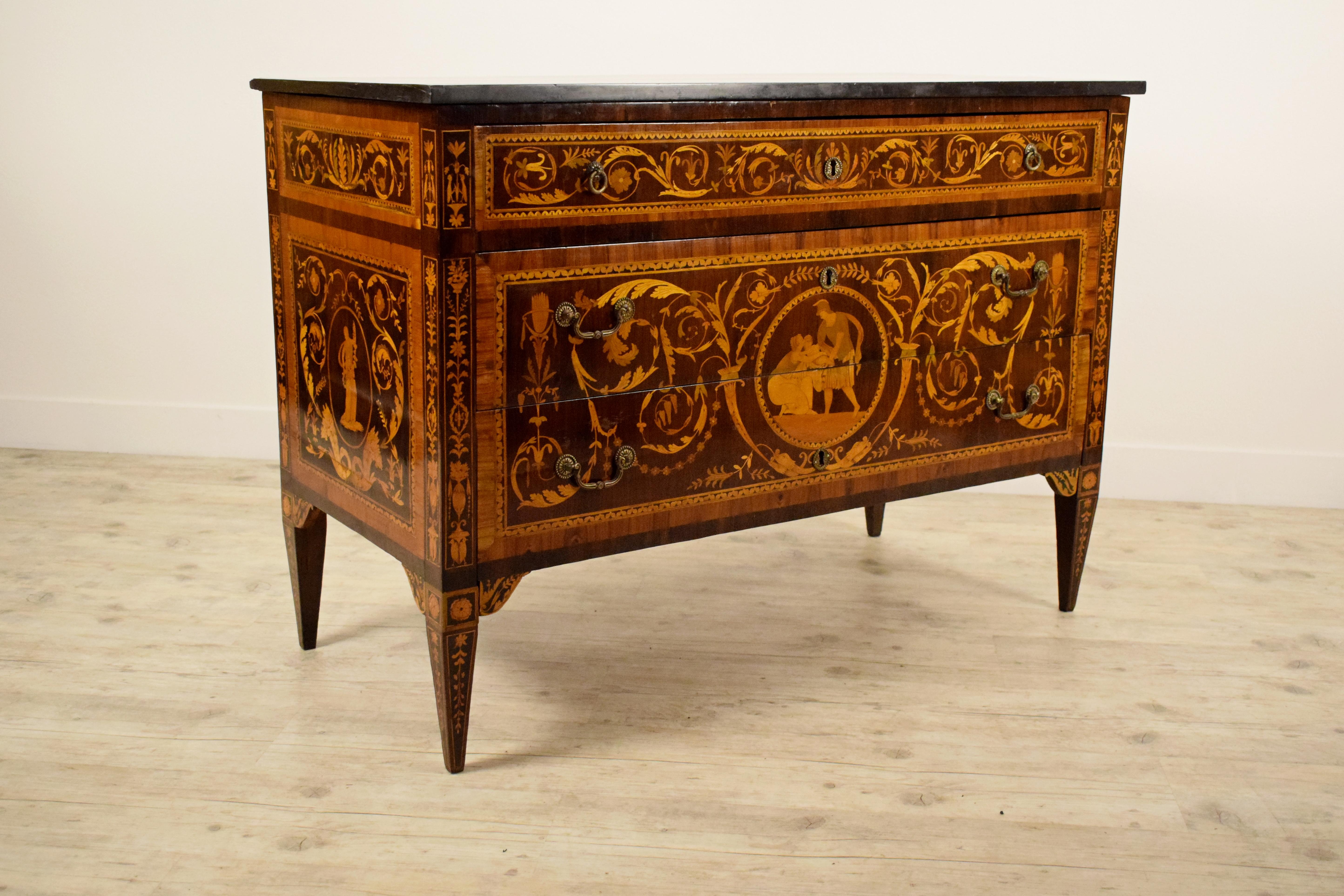 18th century, Italian neoclassical inlaid chest of drawers with marble top

This refined neoclassical chest of drawers was made in Lombardy, Italy, around the end of the 18th century. The cabinet has two large drawers and a smaller upper pull-bar.