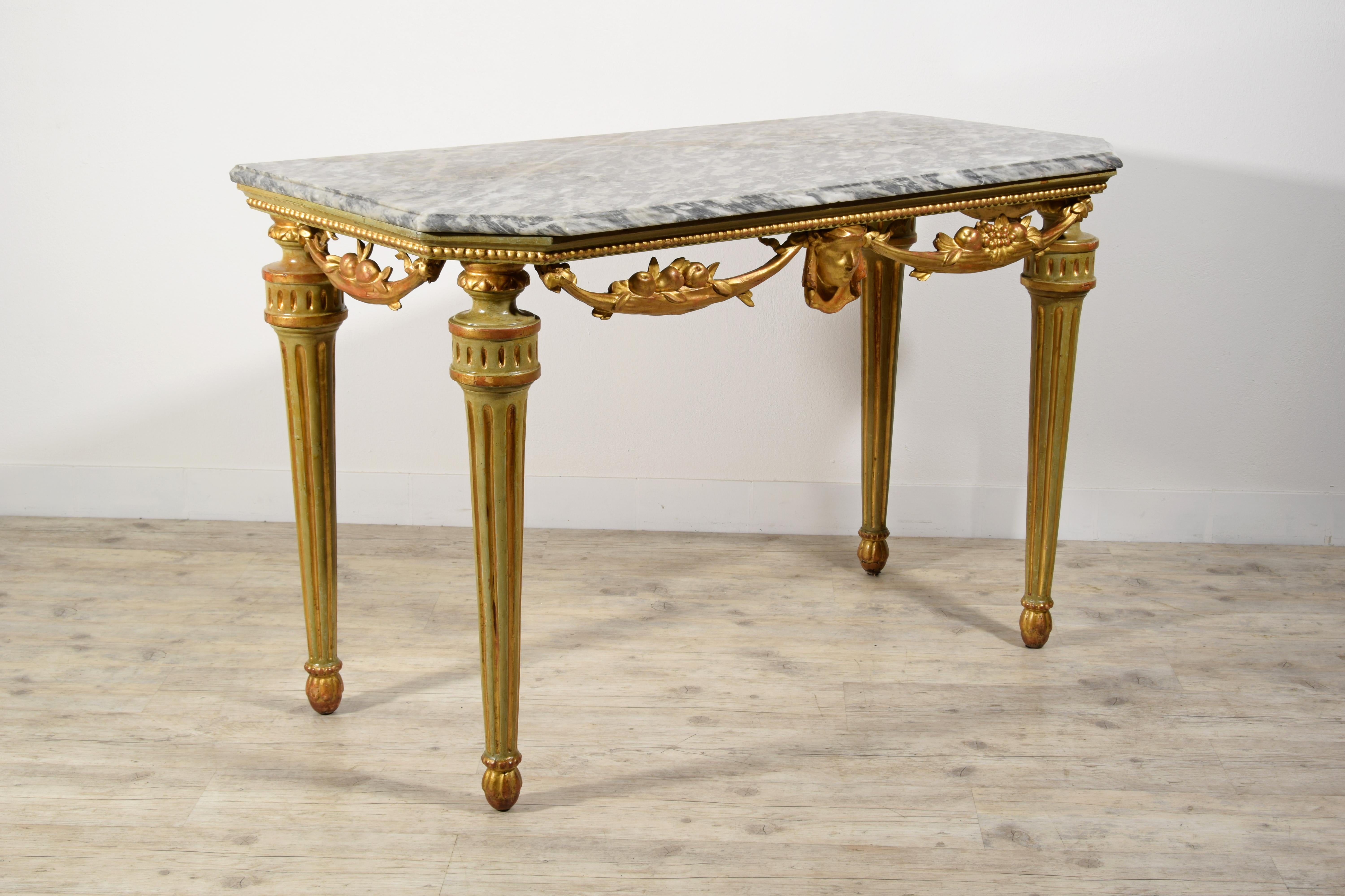 18th century, Italian neoclassical lacquered and gilt wood console table 

This elegant console was made in Italy in the Neoclassical era, in the second half of the eighteenth century. The top, of quadrangular shape with front corners cut at 45