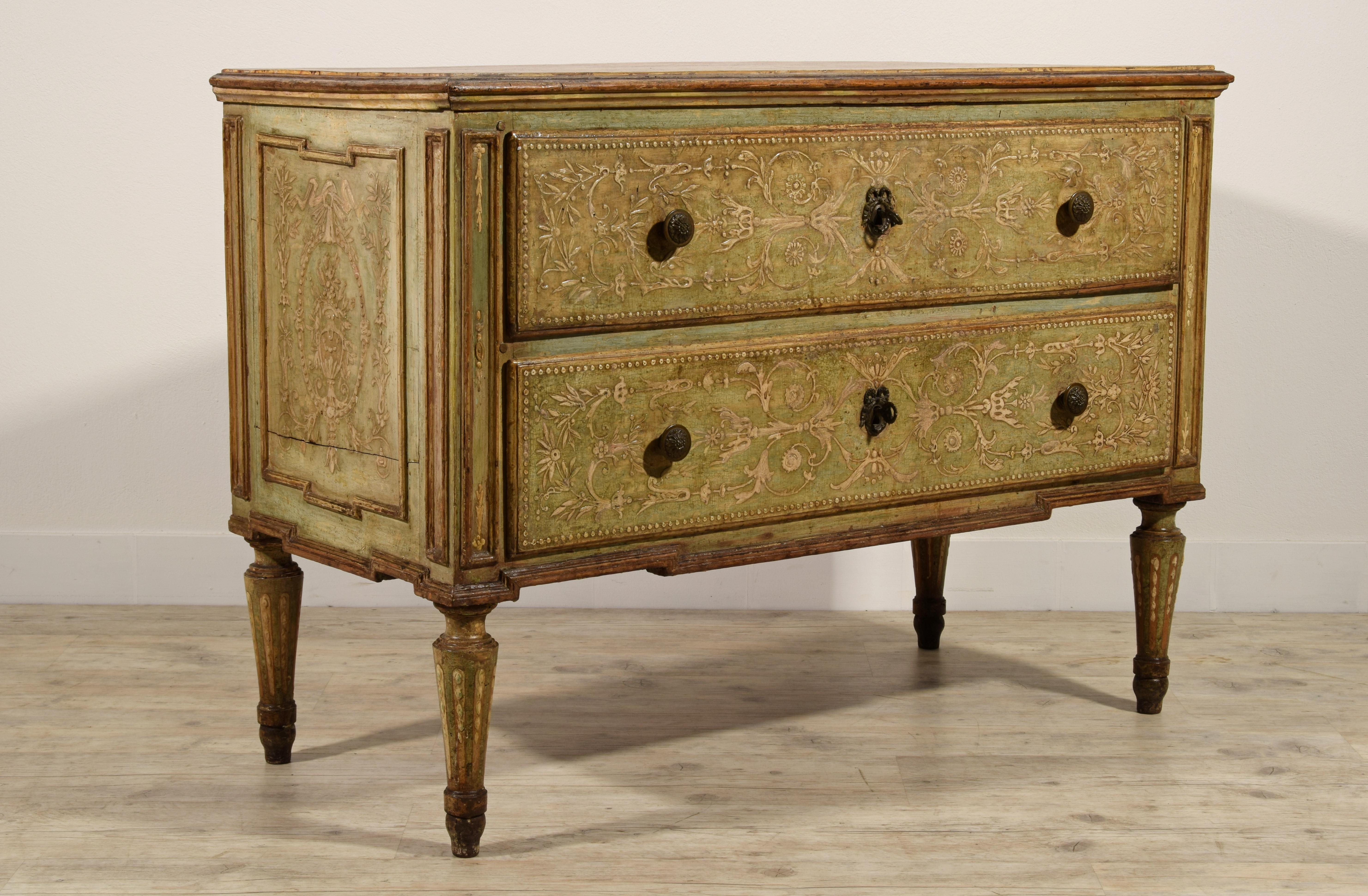 18th century, Italian neoclassical lacquered wood chest of drawer

This elegant neoclassical chest of drawers was made in Turin Italy, towards the end of the 18th century. In carved wood it is entirely lacquered, and decorated with reliefs and