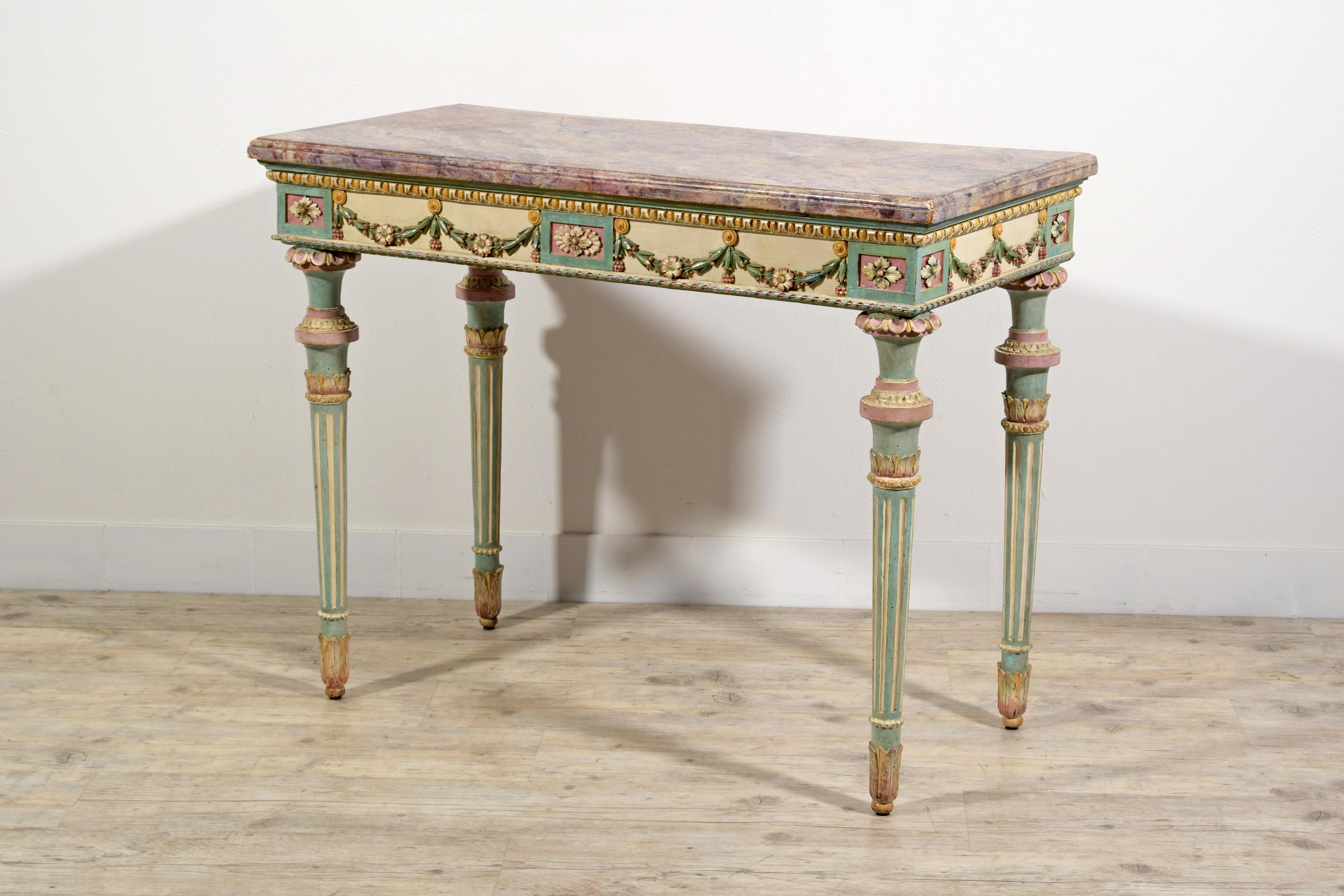 Late 18th Century, Italian Neoclassical Lacquered Wood Console

This elegant console was made in the neoclassical era, in the second half of the eighteenth century in Milan, Italy. The structure is in finely carved wood and lacquered in