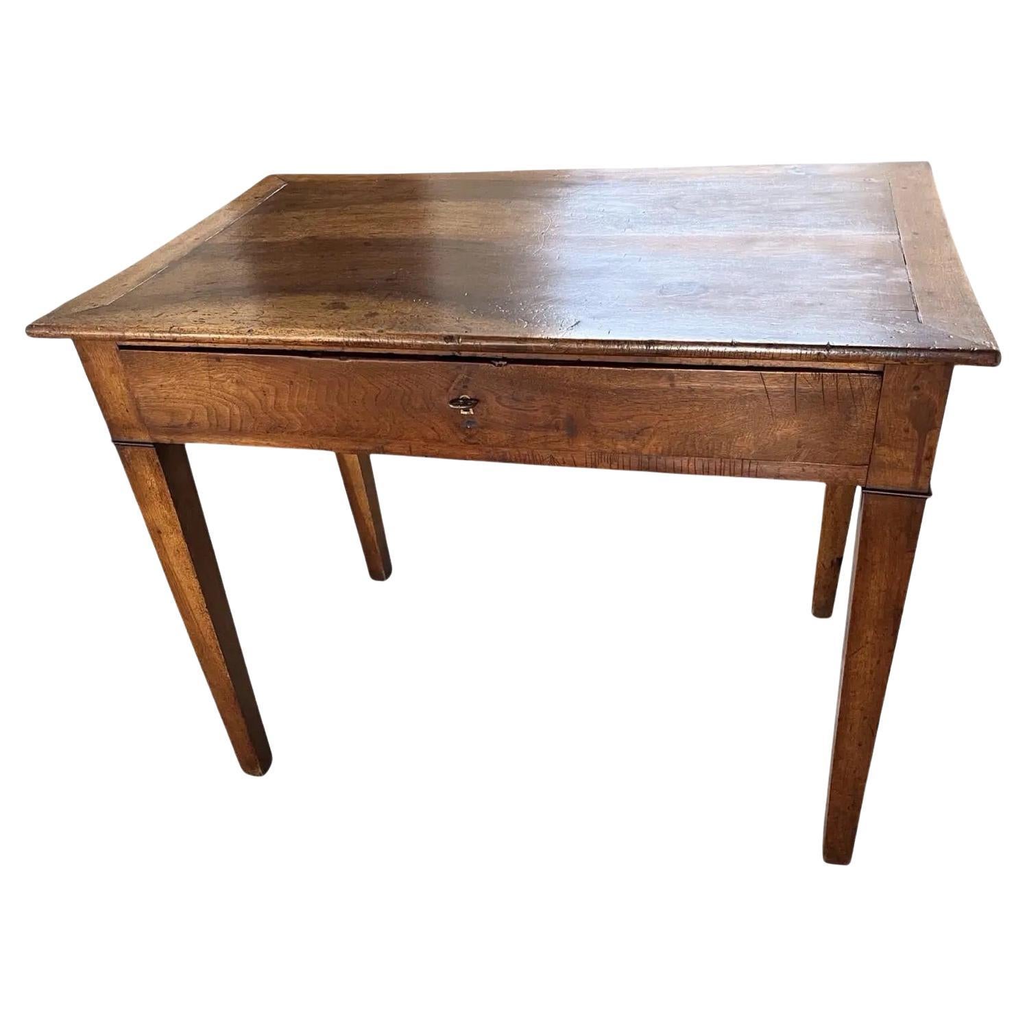 Side table hand-made in Italy in the late 1700s using walnut. The color and overall look of this side table is gorgeous, the top is made of a single board with straight edges and angled breadboards. The top is very interesting because the grain of