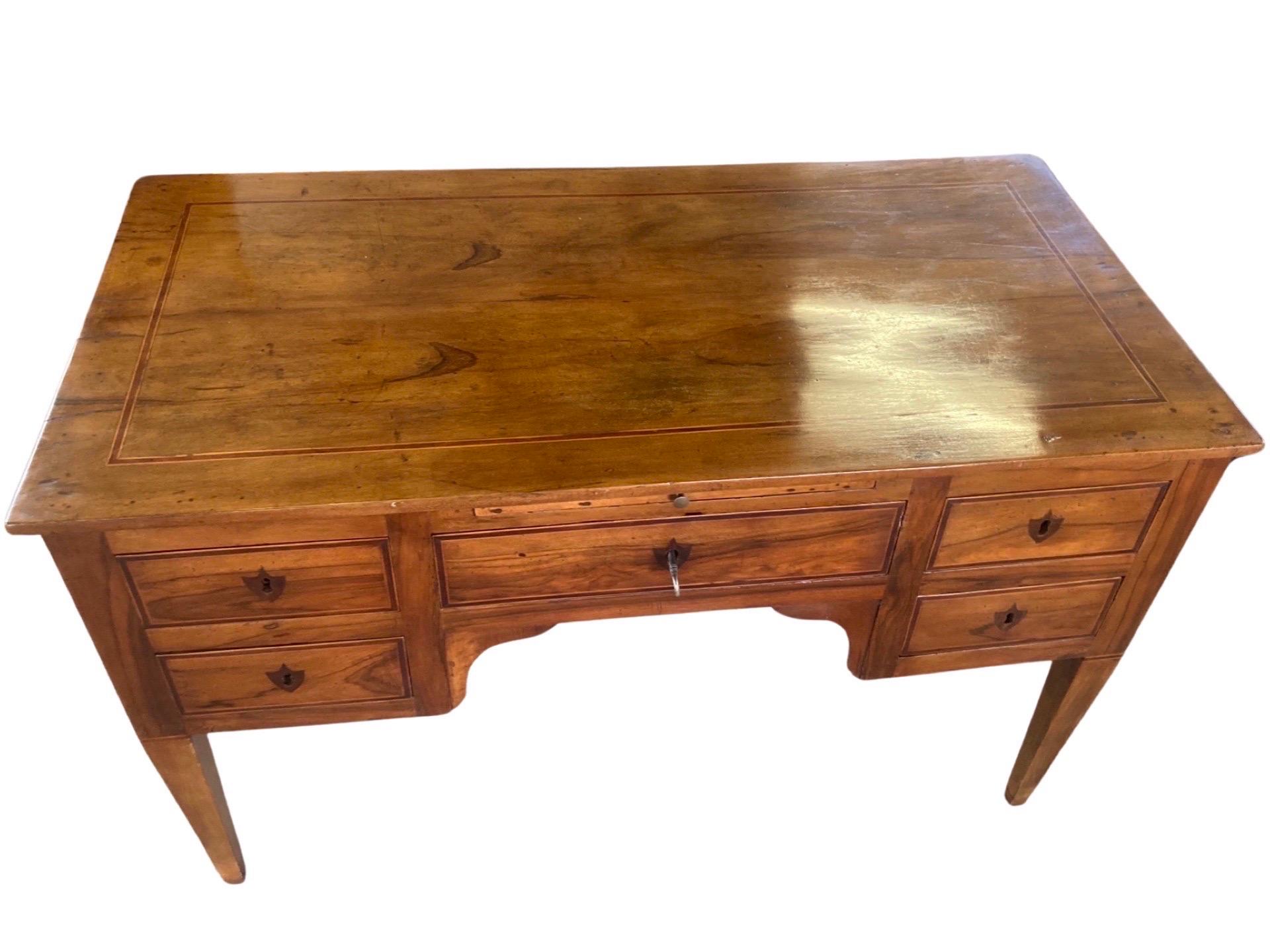 Stunning writing desk hand-made in Italy in the mid 1700s using walnut. This really is the mother of all Italian scrivanie (writing desks): its lines, details and overall look make it a perfect piece for whoever is looking for a classical piece that