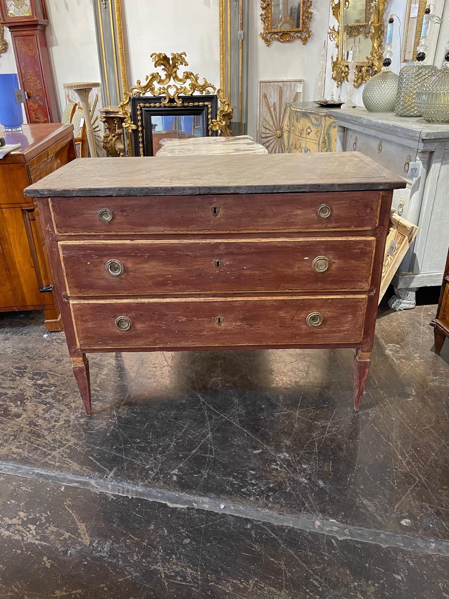 Late 18th century Italian painted neo-classical style commode. Rusty red color with a painted grey top. A handsome piece!