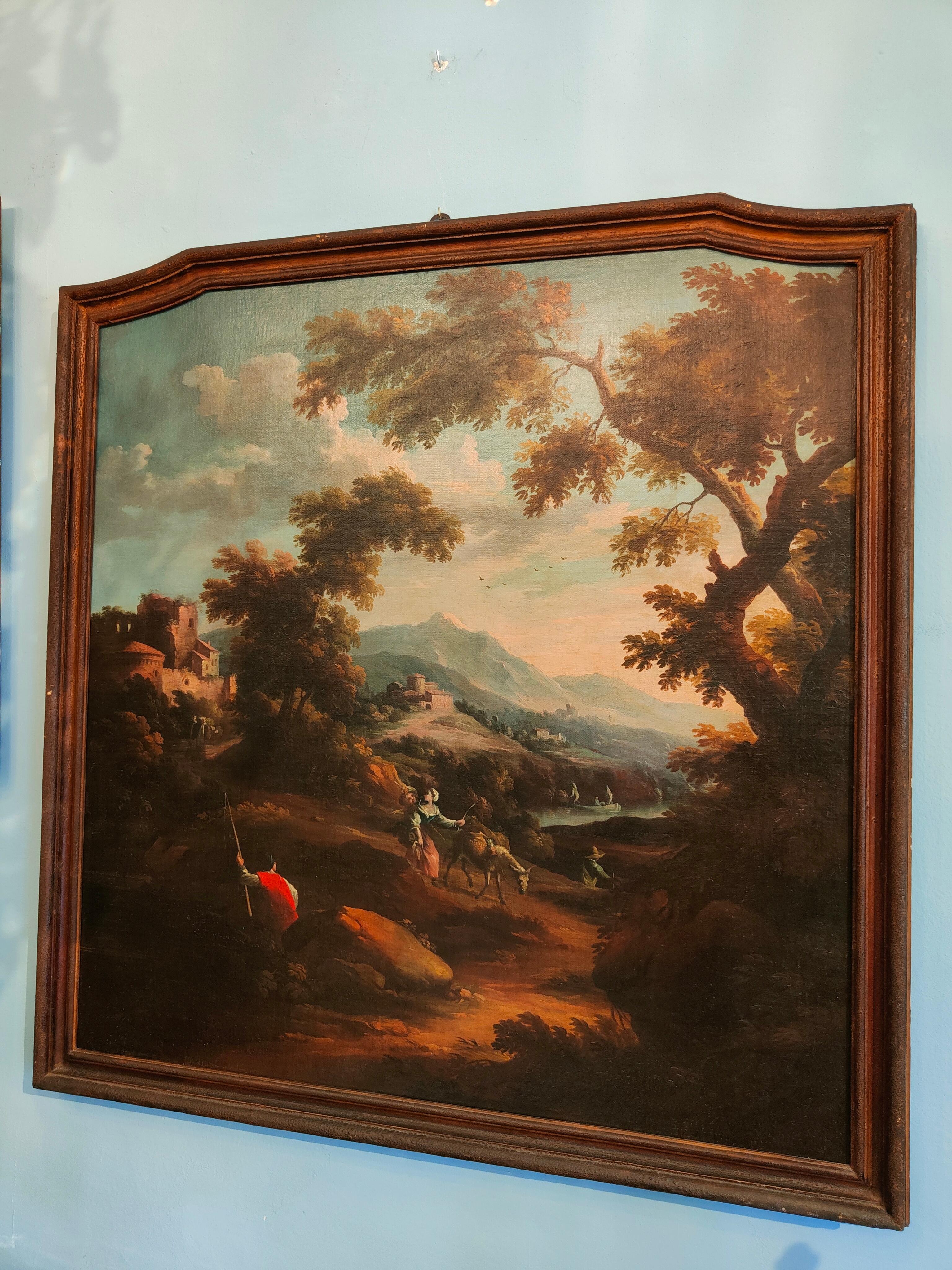 Peinture italienne du XVIIIe siècle du peintre Scipione Cignaroli
La précieuse peinture à l'huile sur toile représente un paysage de la campagne italienne avec des voyageurs sur les rives du fleuve, avec un cadre contemporain (XVIIIe siècle).
Le