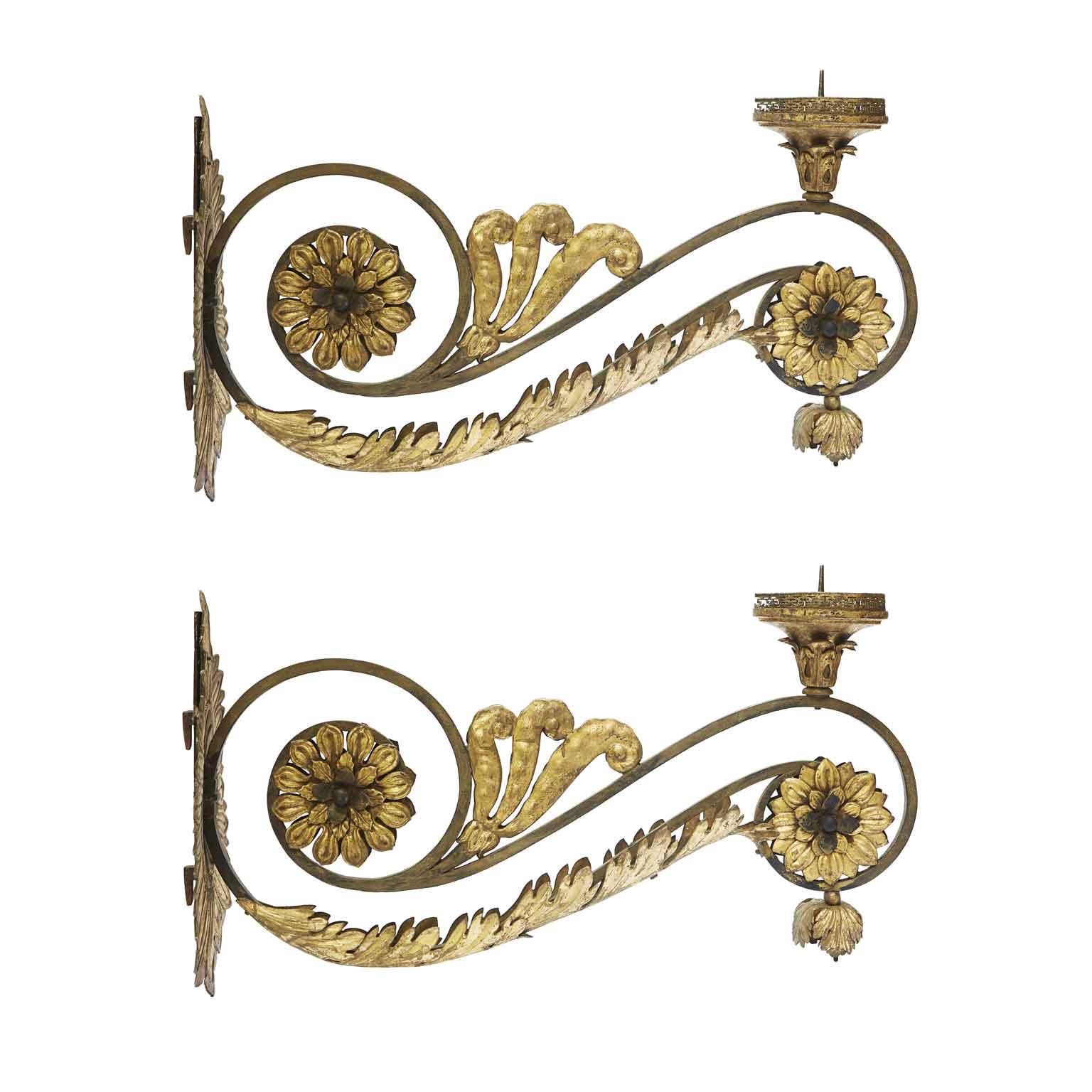 Pair of Large Italian Gilded Sconces With Sunflowers and Scrolls from 1700 Arms For Votive Lamps made with an important wrought-iron scrolling structure with a square cross-section and decorated with embossed and gilded copper vegetal and floral