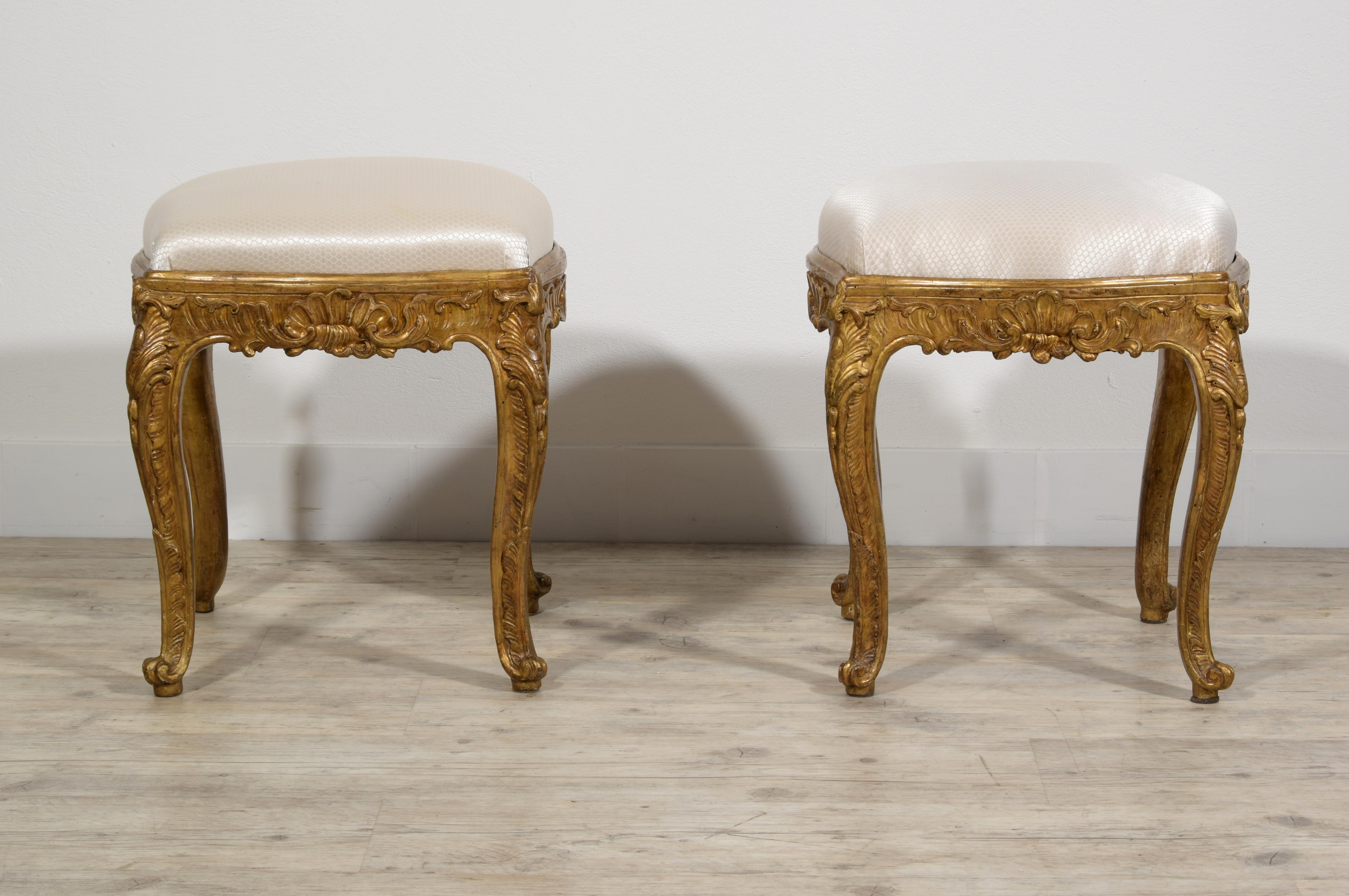 18th Century, Italian Pair of Gilt Wood Louis XV Stools 
This fine pair of stools was made in Naples, Italy, around the middle of the eighteenth century, in the Louis XV era.
Each stool is carved in wood and has bands and legs moved and arched,