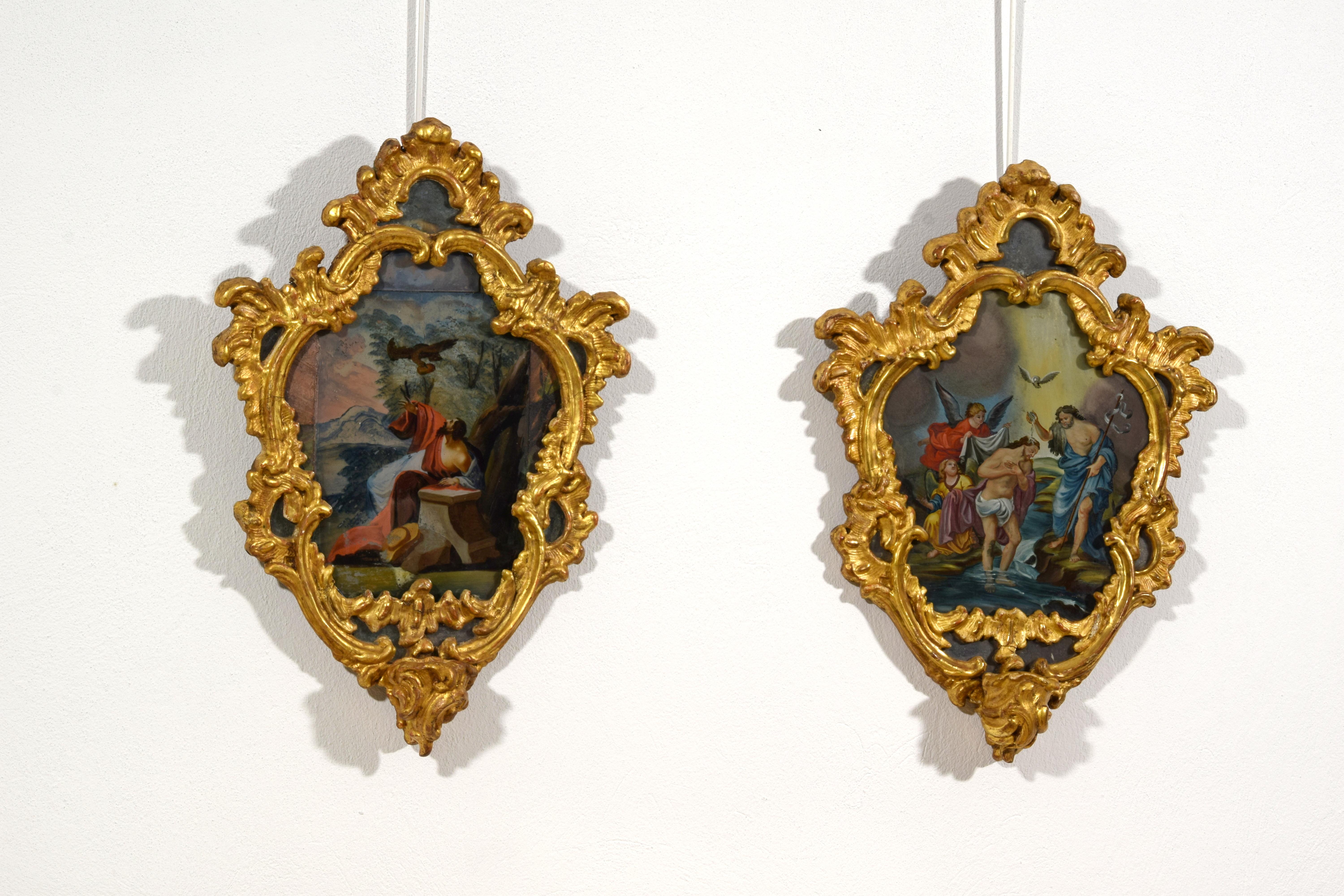 18th Century, Italian Pair of Paintings on Glass in Giltwood Frames

This exquisite pair of paintings executed on glass is presented within finely carved and gilded wooden mirrors dating back to the mid-18th century, crafted in Piemonte, Italy.
The
