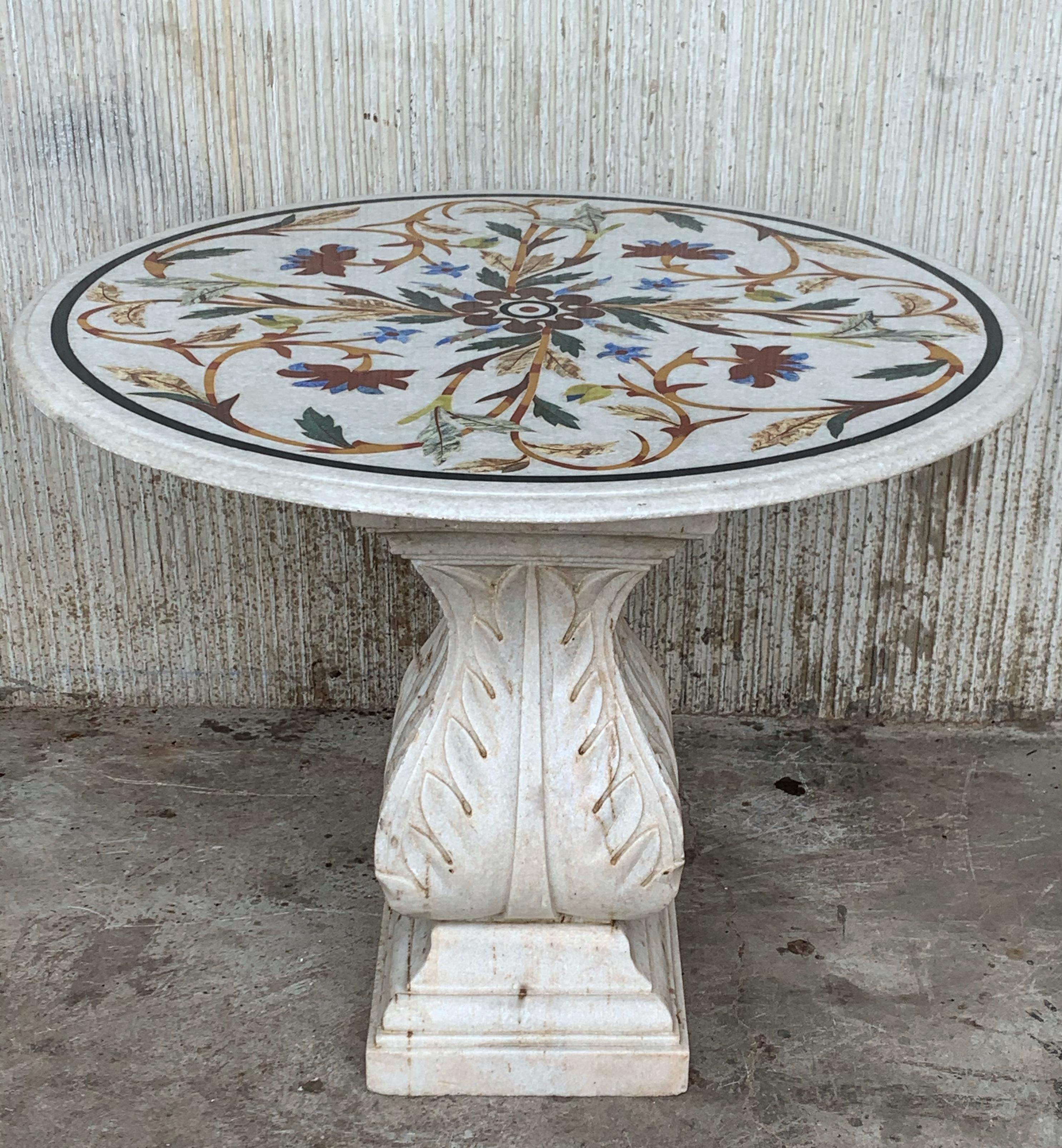 Rare 18th century Italian white marble Pietra Dura and marquetry stone inlaid top dining table with colorful floral vine decoration on white ground, set on carved Carrara pedestal
The inlays are made of lapis lazuli and precious stones.