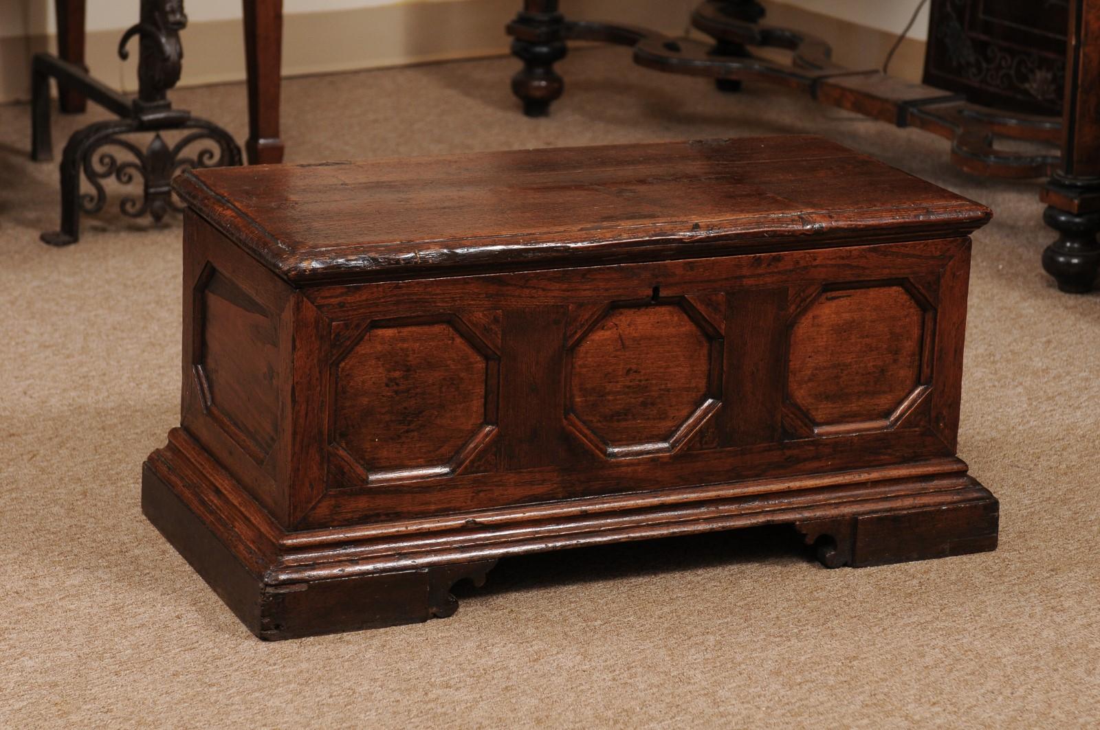 Pine coffer / trunk with hinged lid, octagonal carved designs, and bracket feet, 18th century.