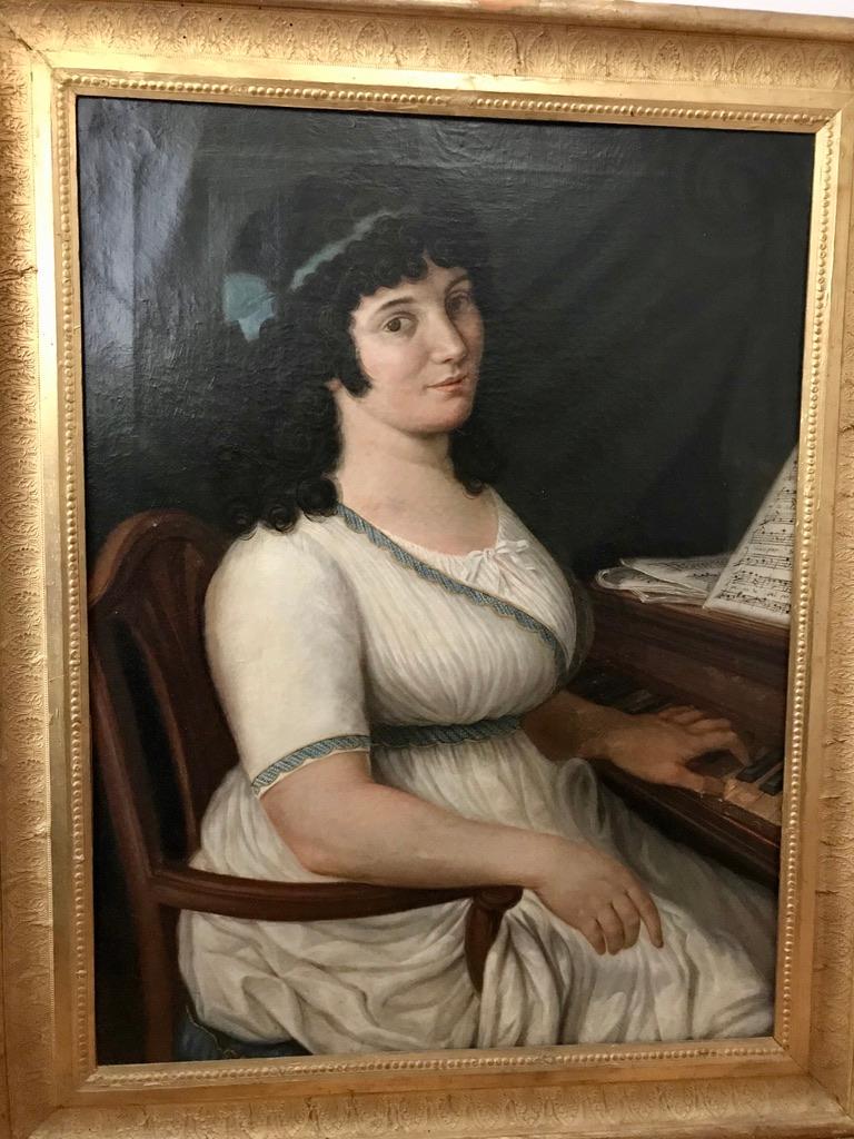Late 18th century neoclassical Italian oil painting of a woman playing piano. Inscribed on the reverse Teresa Manfredi, likely the daughter of the famous Lucca violinist and composer, Filippo Manfredi. Signed on the reverse Paolo de Giusti Di Lucca,
