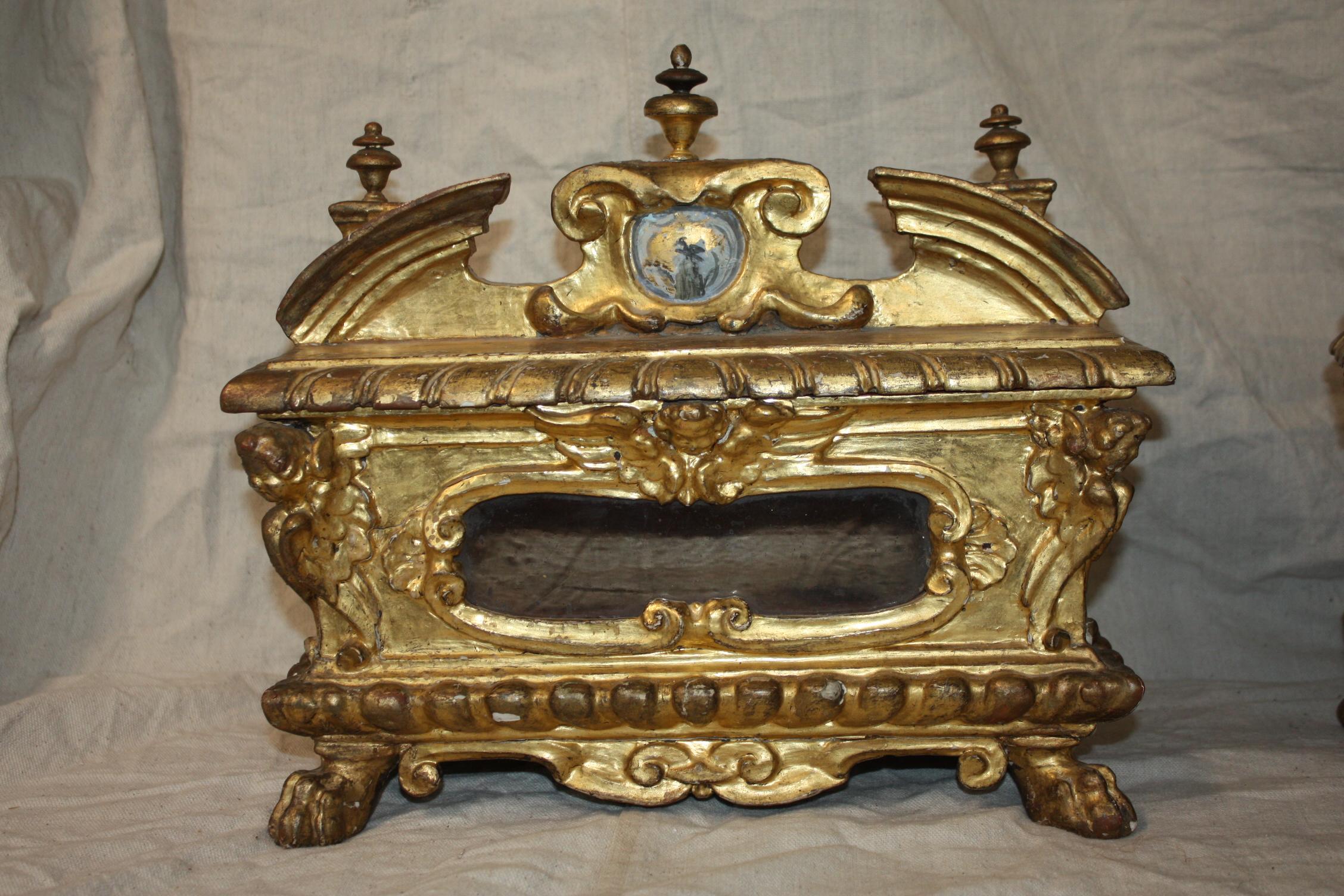 I recently purchased a pair of 18th century gold gilded Italian reliquaries. They are very attractive. All the glass is original with a wavy look. The backs have been replaced in more recent times which I believe is probably because originally they