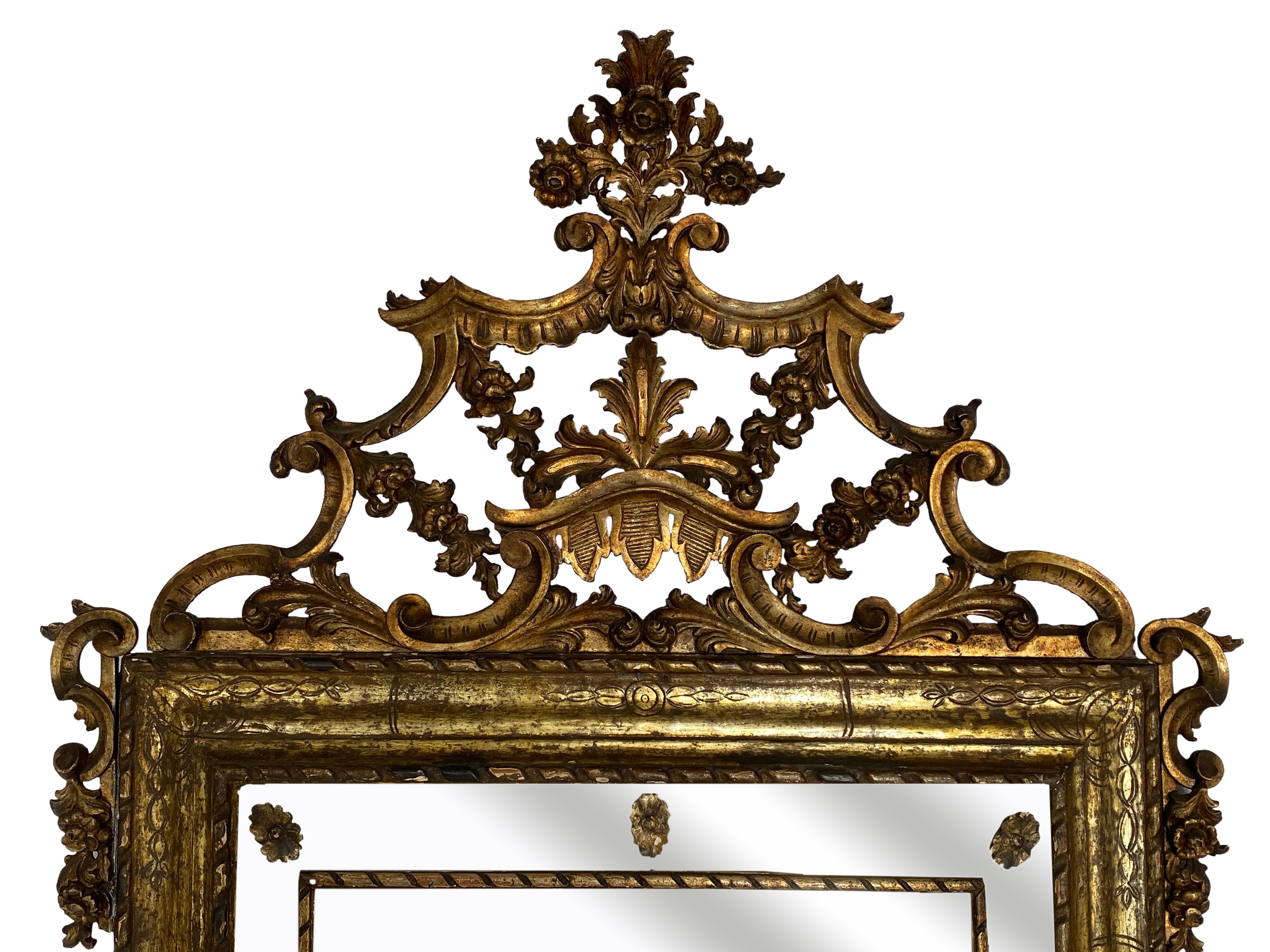 18th century Northern Italian Rococo giltwood mirror. Very detailed carving.