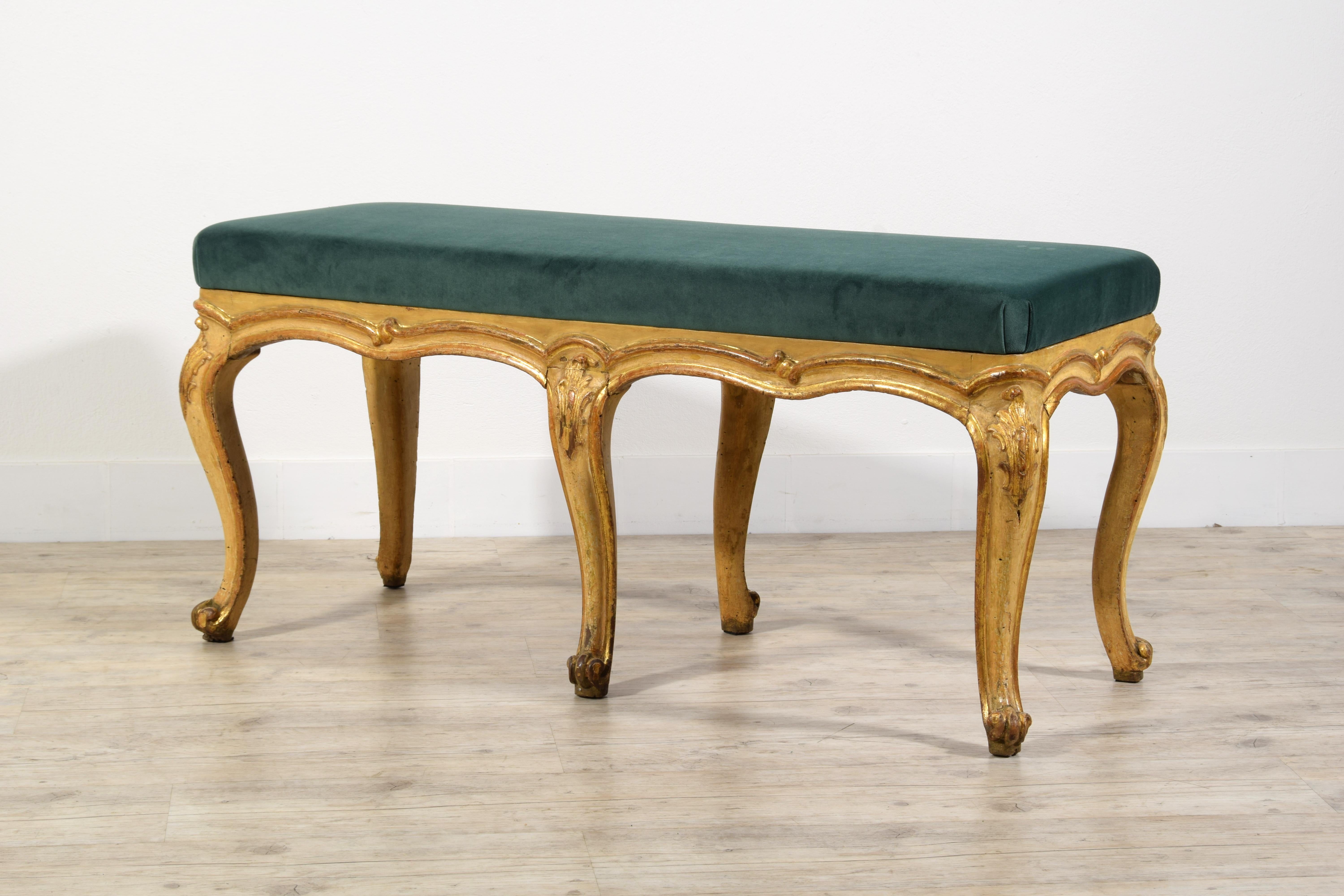 18th century, Italian Lacquered and Gilt Wood Bench 
This elegant bench in lacquered and gilded wood, was made in the Rococo period in Genoa, Italy, around the middle of the eighteenth century.
The under-top band is carved with a profile with a