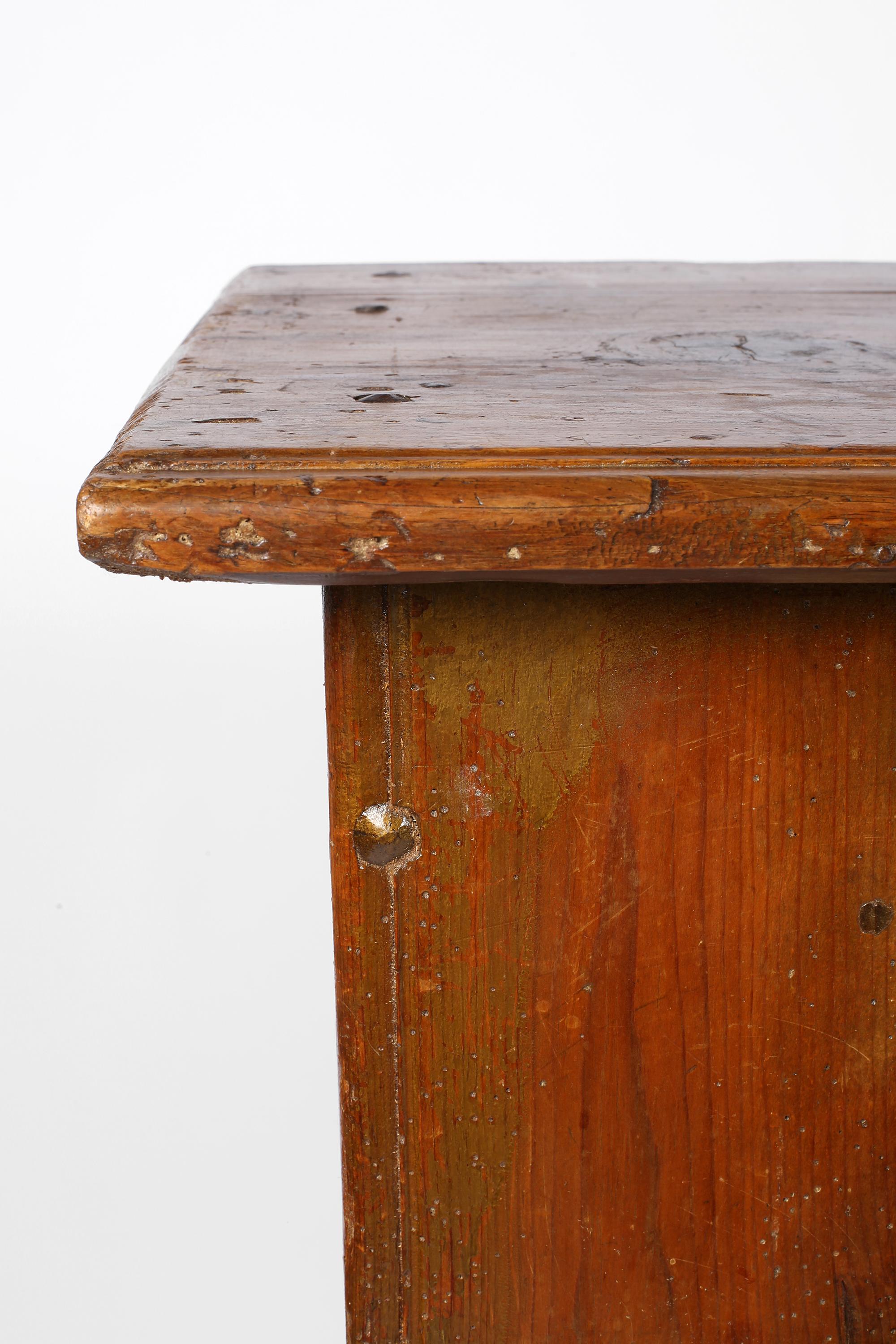 A charming, 18th century two-door credenza from the Veneto region in beautifully patinated pine timber with faint traces of historic gilding. With useful, slim proportions and original forged iron door pulls, the doors open to reveal two internal