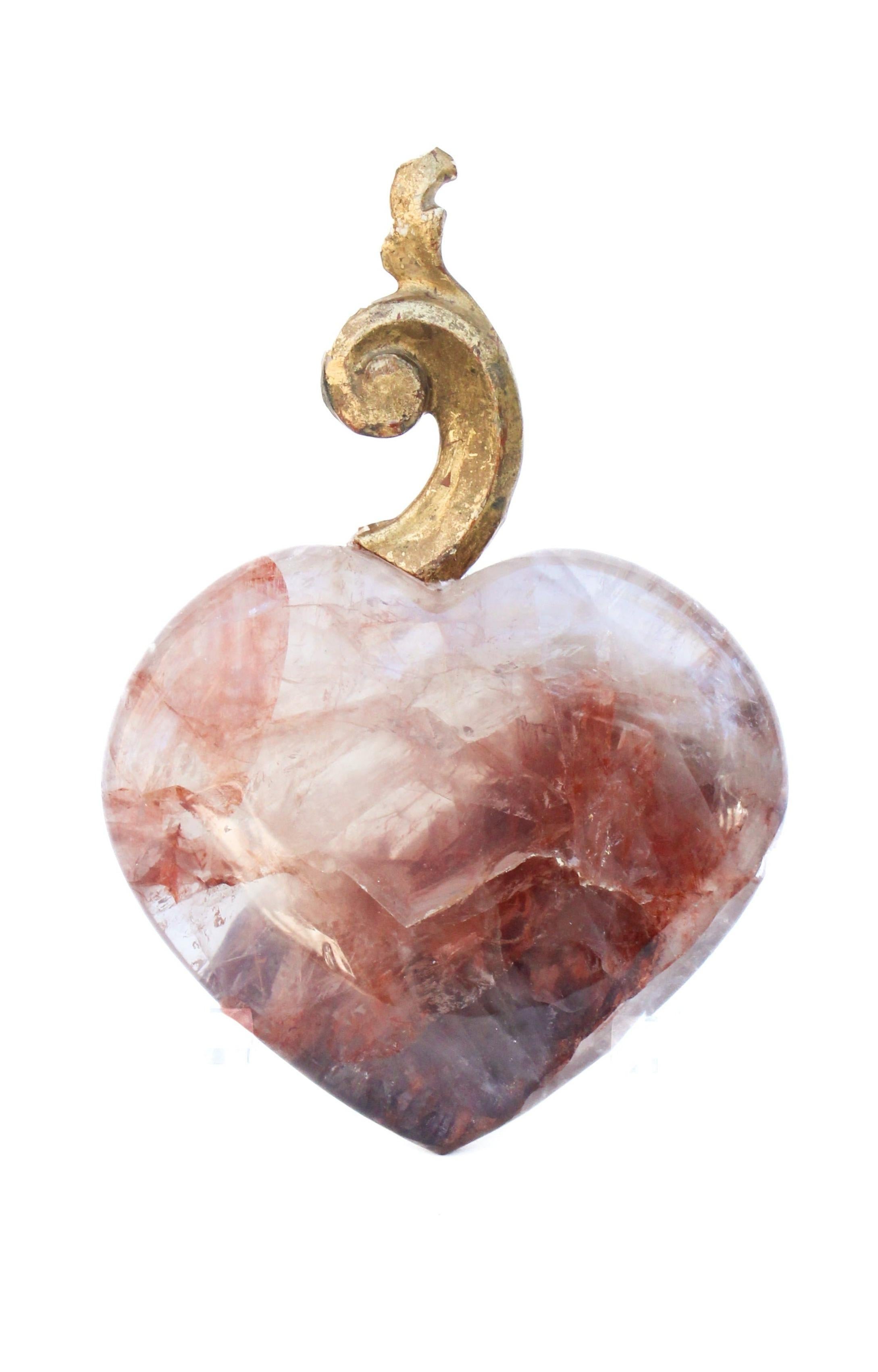 18th century Italian gilded scroll fragment mounted on a polished red and white hematoid quartz heart. The piece is inspired by 