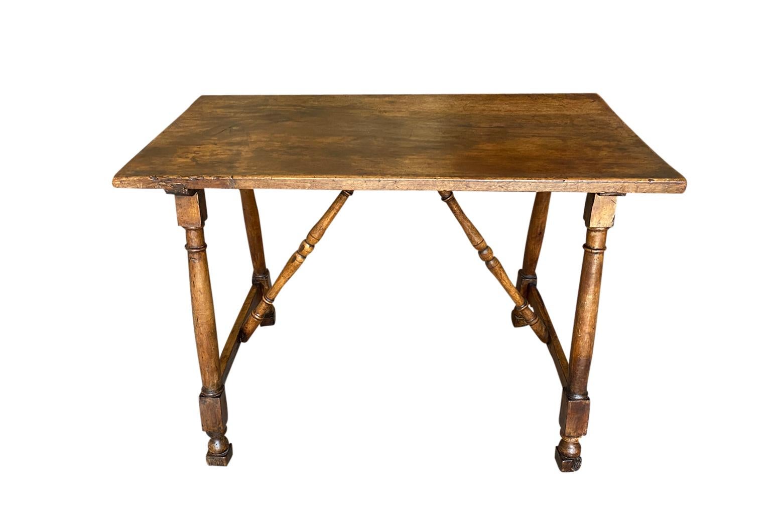A stunning 18th century side table - console from the Tuscan region of Italy. Beautifully constructed from beautiful walnut with wonderful turned legs and stretchers. Fabulous patina - warm and luminous. Perfect as a writing table.