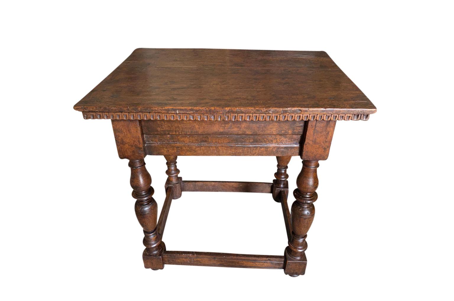 A very handsome 18th century side table from Tuscany. Beautifully constructed from stunning walnut with nicely turned legs and dentilated detail. Wonderful patina.
