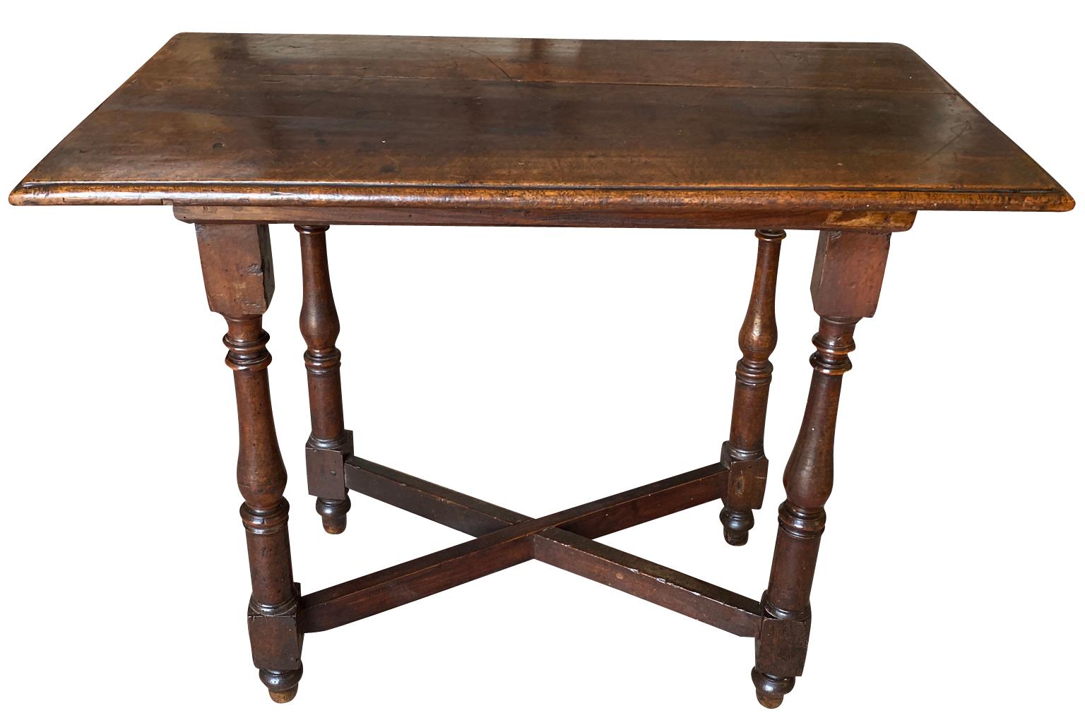 A very charming 18th century Side Table from the Tuscany region. Beautifully constructed from handsome walnut with nicely turned legs and an 