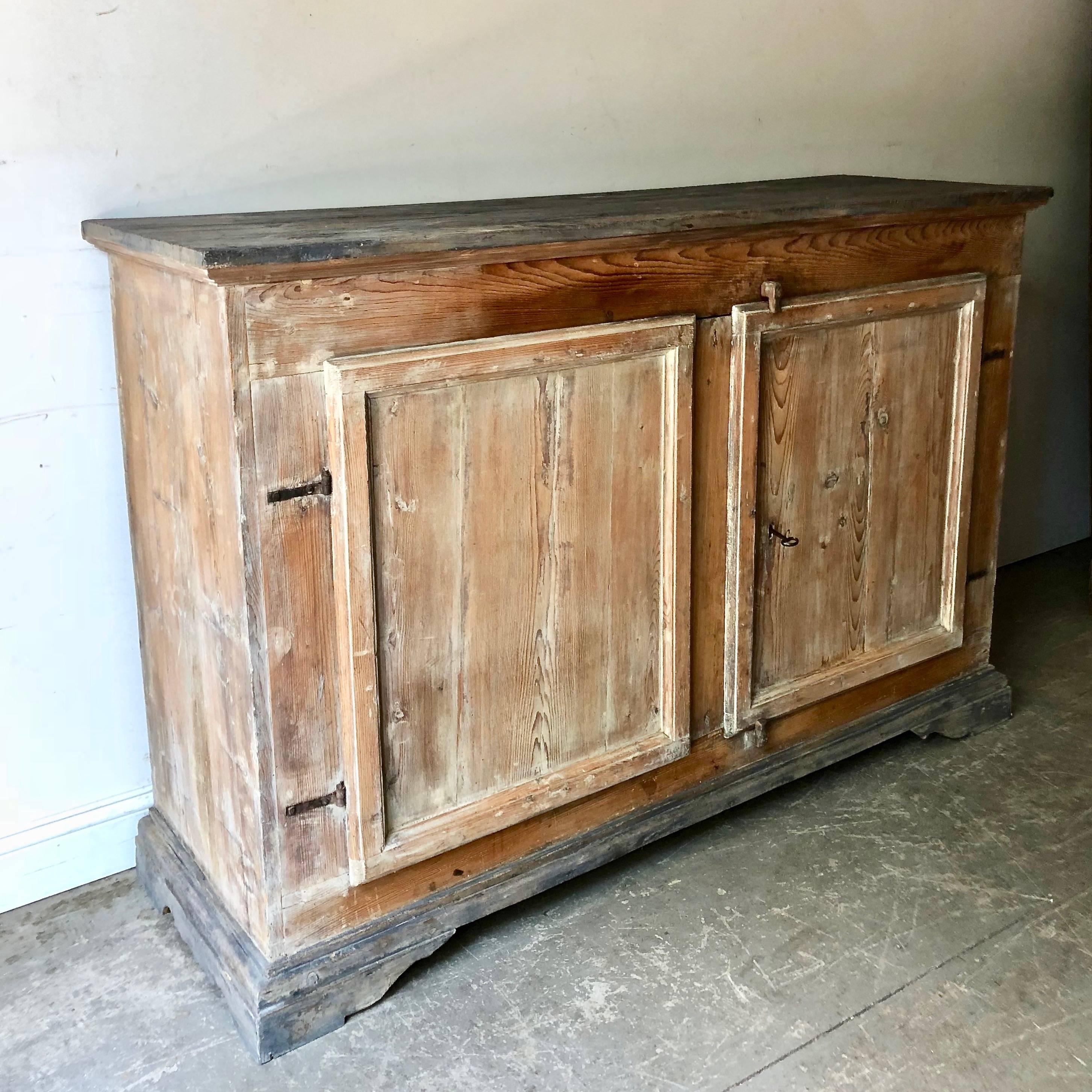 Handsome, large 18th century Italian sideboard with two large panelled doors and all original locksand hinges.
 
 