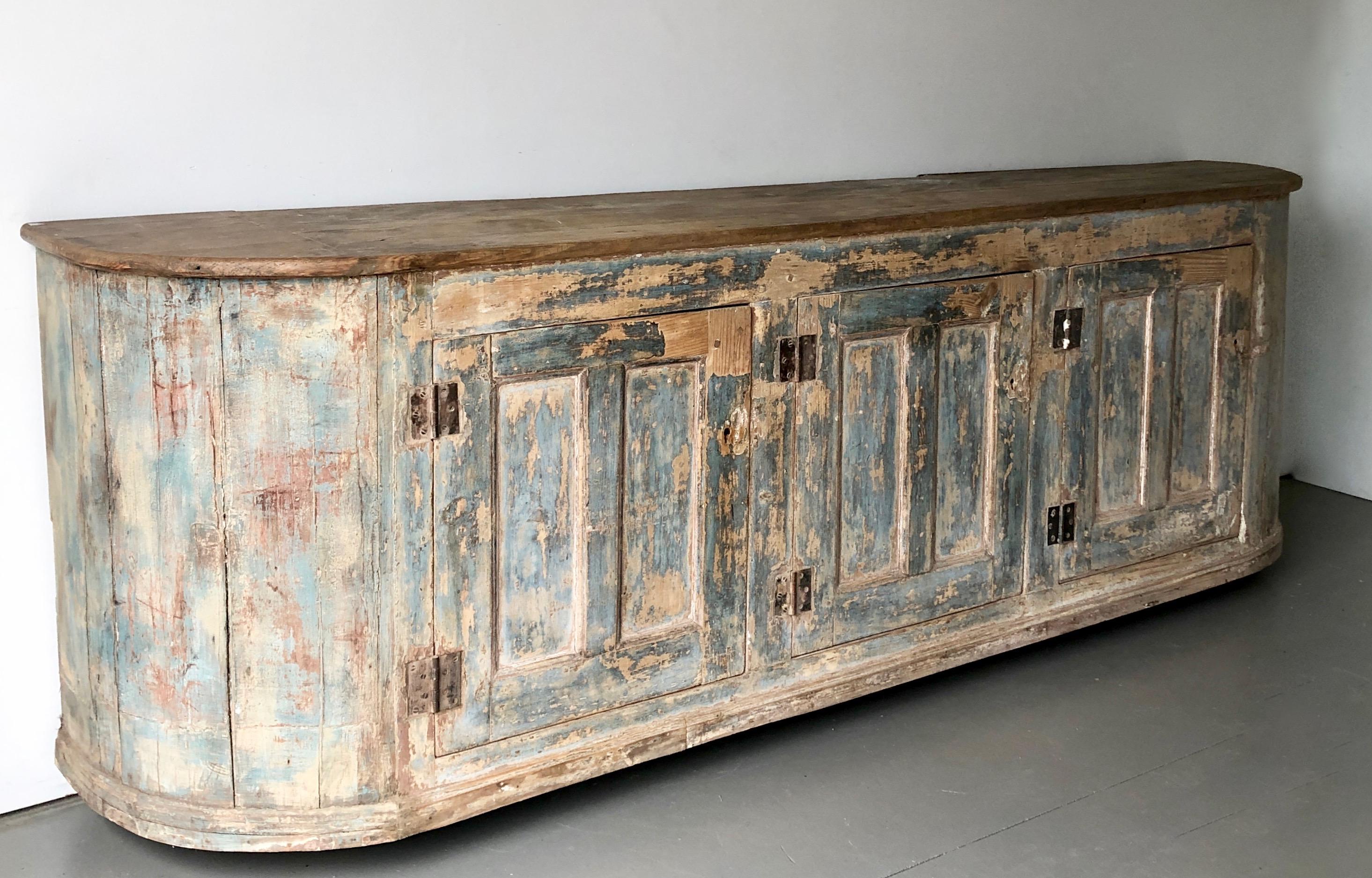 Incredible, long, very patinated with original blue color Italian, 18th century Sideboard with three paneled large doors under natural rounded shape blank top.
(Photographed with moving dollies underneath)
More than ever, we selected the best, the