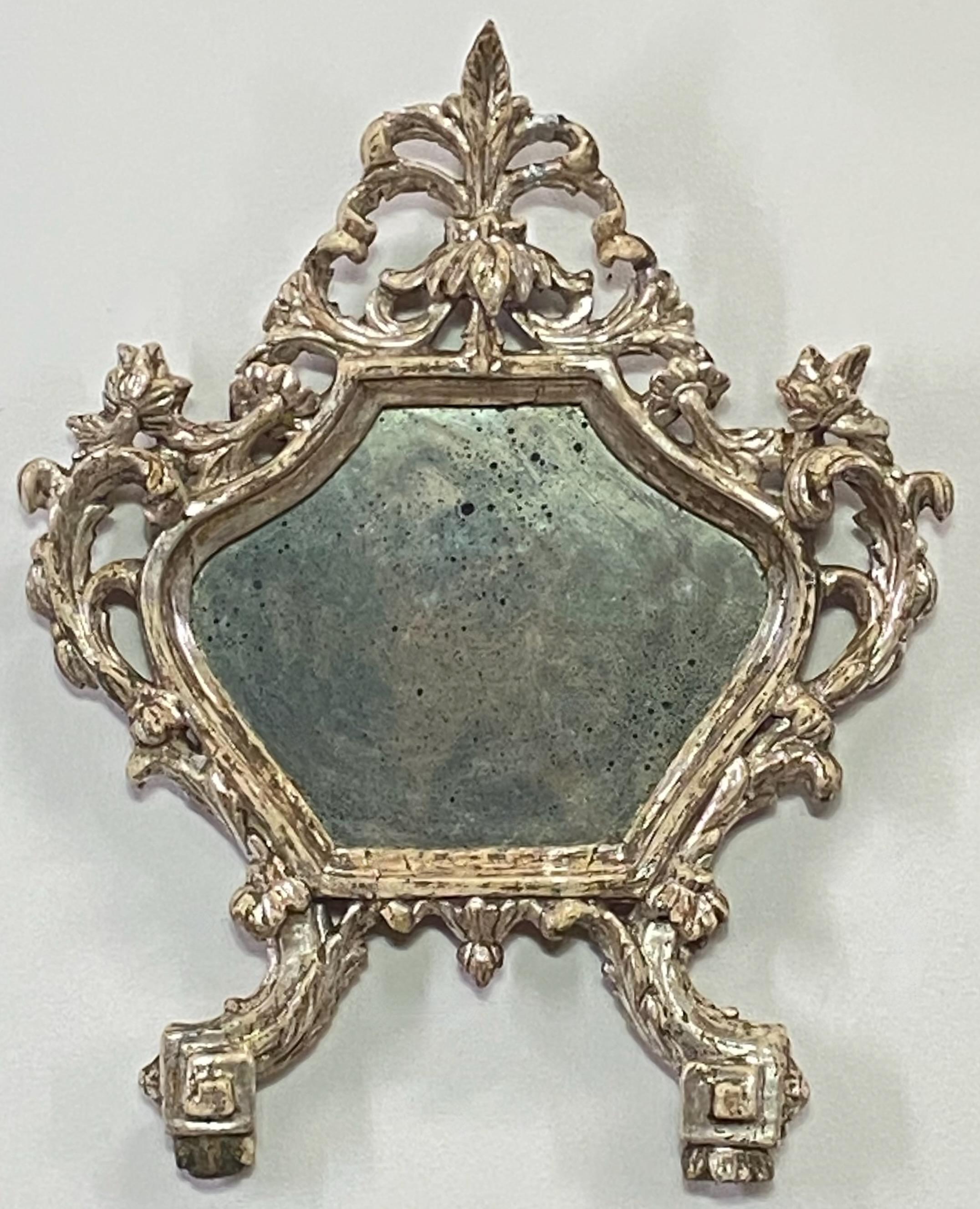 Late 17th or early 18th century Italian Memento Mori silver gilt frame. This would have originally held a prayer or poem on paper or canvas. Now replaced with a antiqued distressed mirror in ex cond. Has some relatively minor loss of silver gilding.