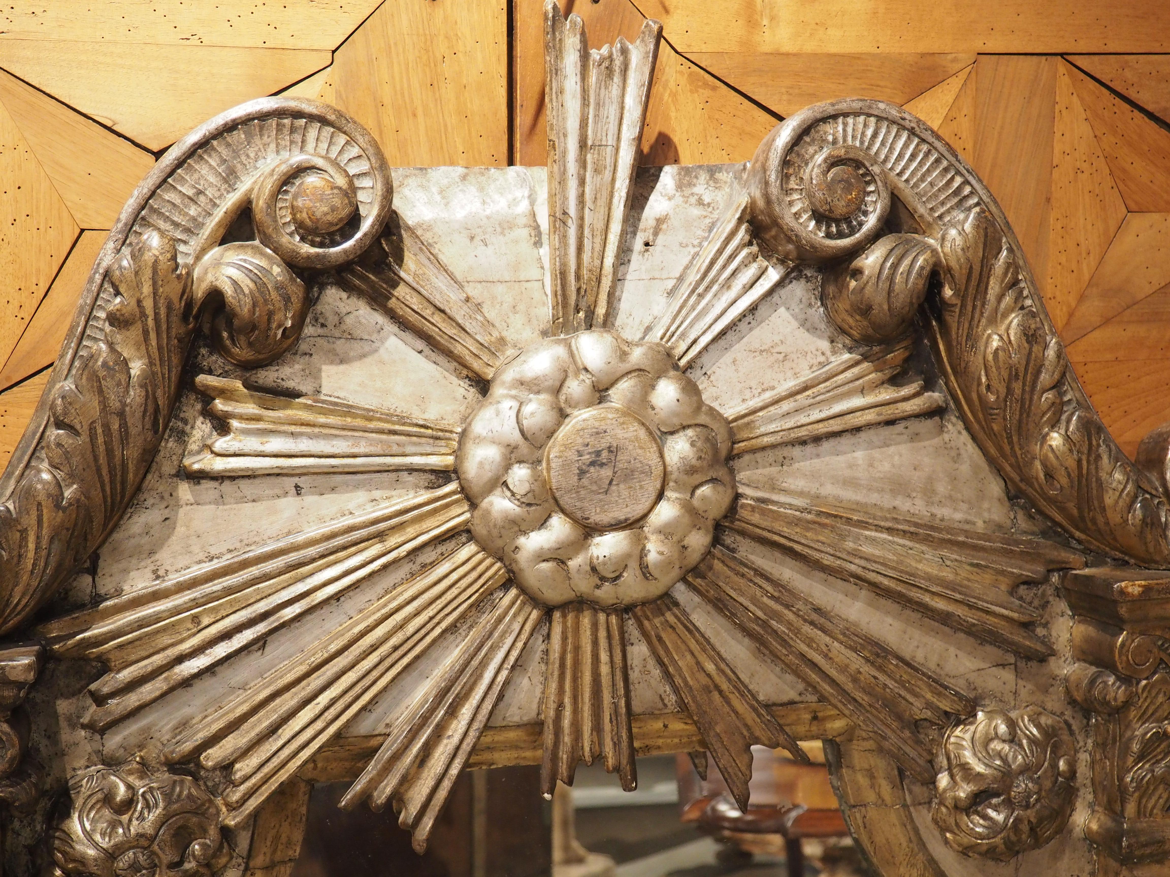 18th Century and Earlier 18th Century Italian Silvered and Giltwood Parecloses Mirror with Sunburst Crest For Sale