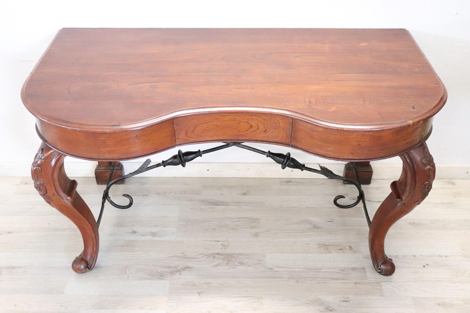 Rare Antique console table 1780s. The console is made of solid oak wood. On the front two comfortable drawers. The front legs are sinuous and moved as the Louis XV period dictates. A wrought iron decoration acts as a cross between the legs.