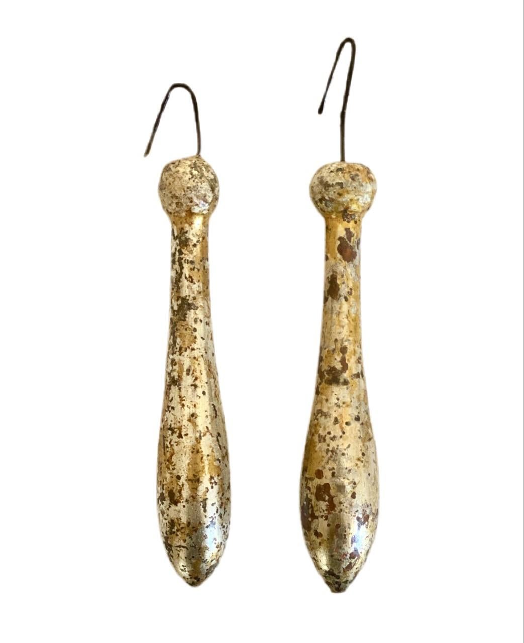 18th Century Italian hand-carved speckled gold and silver leaf tassel ornaments.

The tassels originally came from an Italian church in Tuscany and were used during feast days. These tassels were commonly used to adorn 18th and 19th century French
