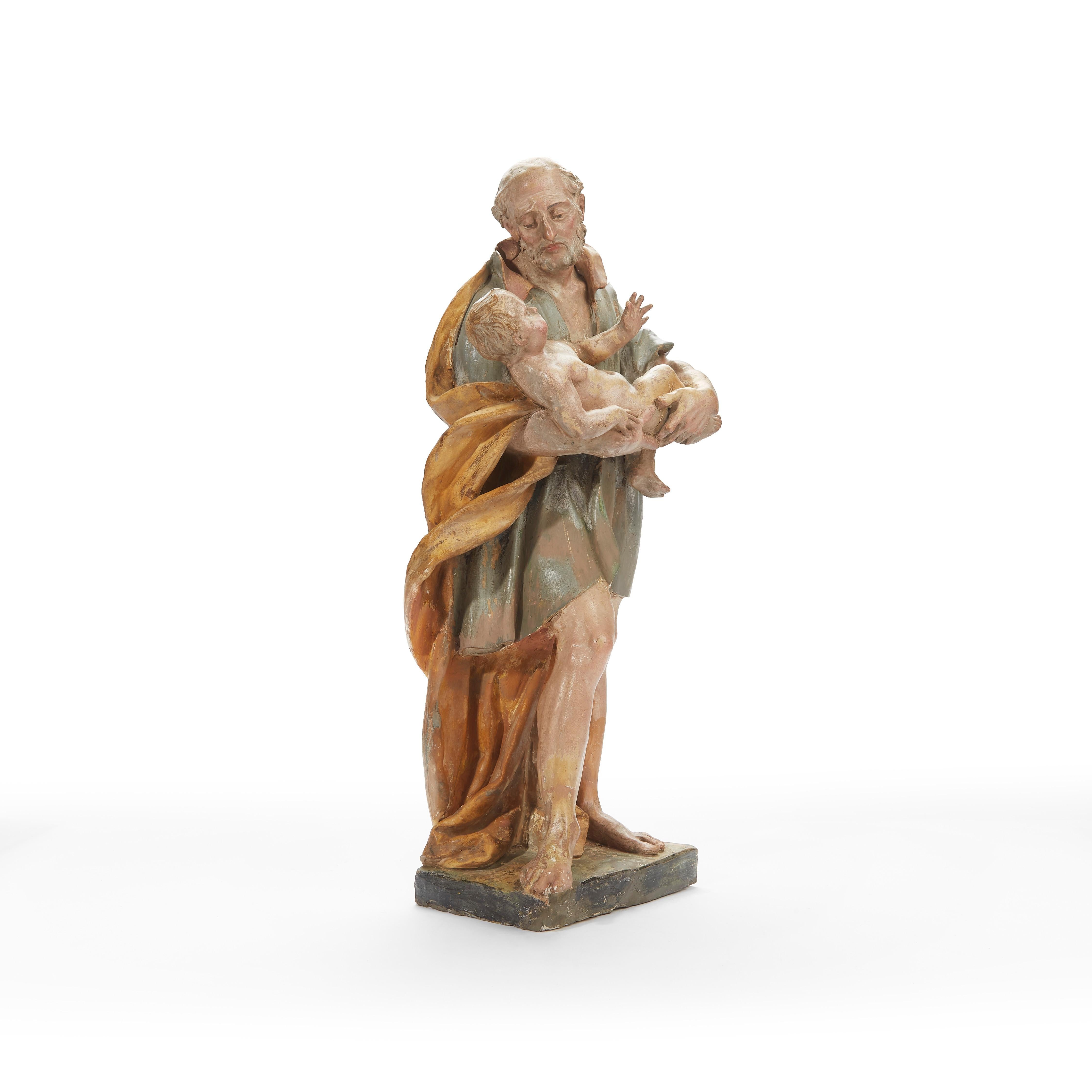 From Italy a superlative Bolognese Baroque polychrome earthenware Saint Joseph with Infant Jesus sculpture, circle of old master Angelo Gabriello Piò, Bologna 1690-1770, dating back to the first quarter of 18th century in good age related condition,
