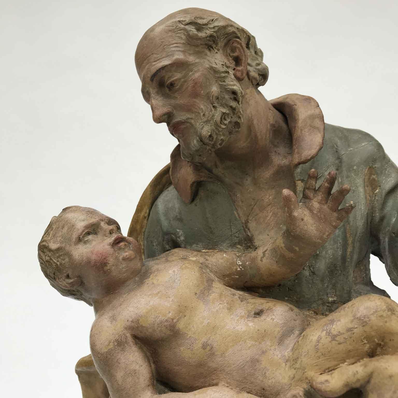 Escultura barroca italiana del siglo XVIII de San José con el Niño Jesús del Viejo Maestro Terracota en venta