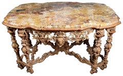 18th Century Italian style marble top, carved gilt wood centre table.