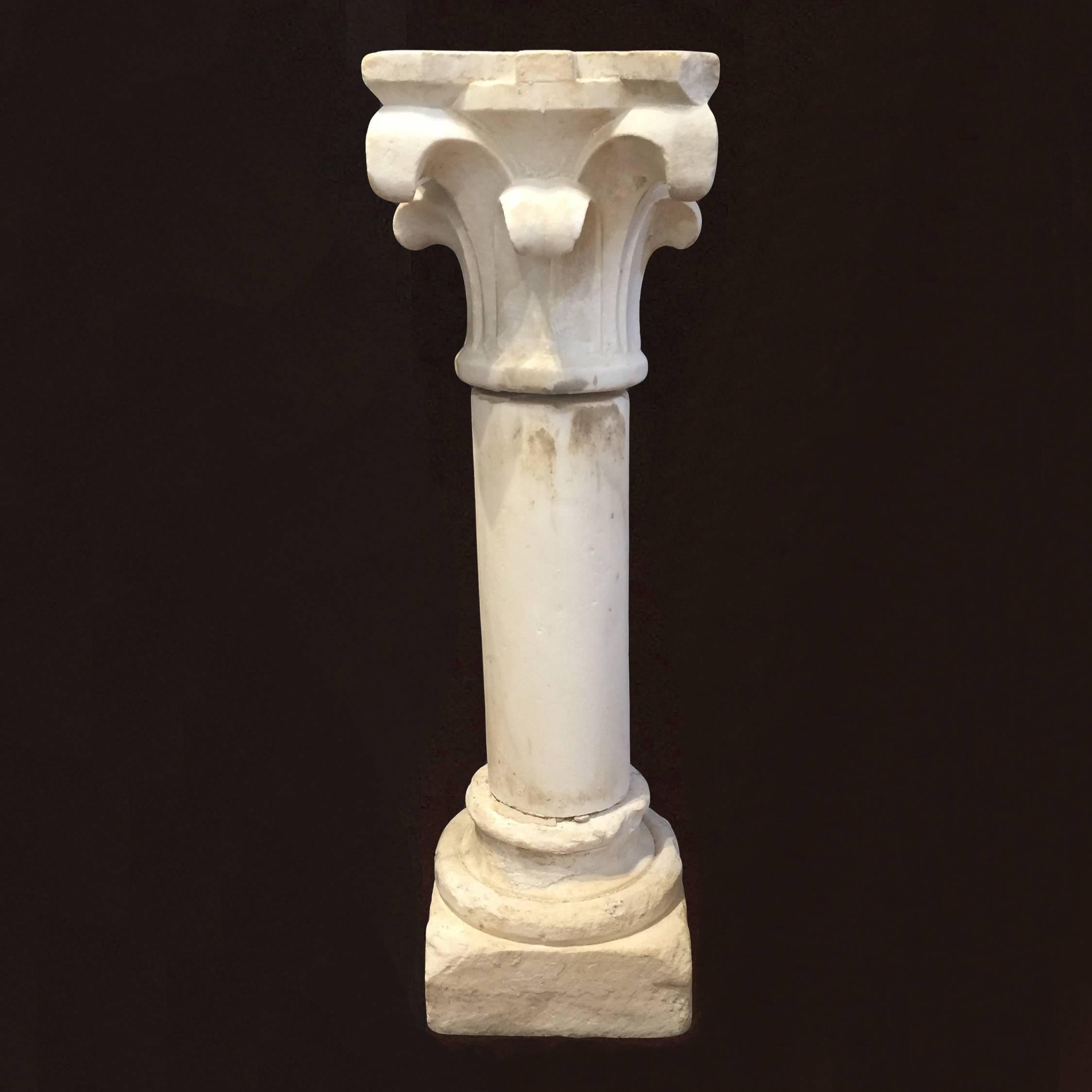 A charming three-piece carved white marble column or pedestal with Corinthian capital.
The single marble pieces are connected by a small iron structure.
Beautiful capital inspired by the antiques
Tuscany, late 18th Century
Perfect eye catcher