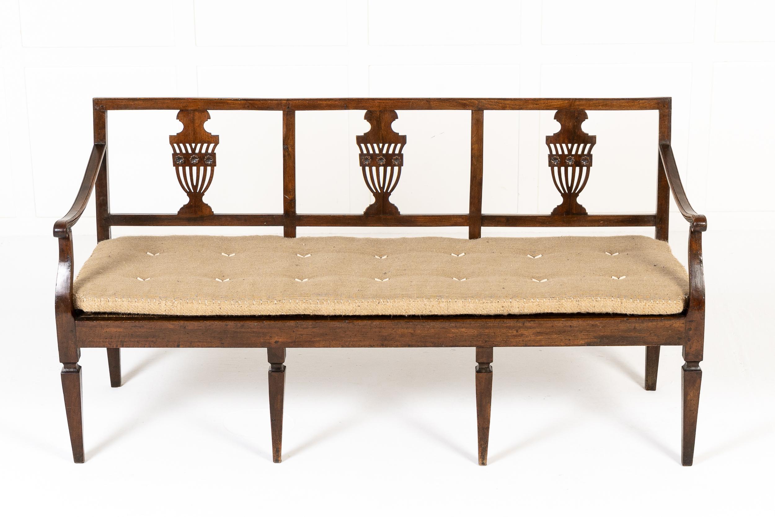 An 18th Century Italian Neoclassical Period Walnut Chairback Hall Bench/Settee.

This bench was made in Italy in the late 18th century and it is conceived in the chair-back manner, the back splat being formed of three joined chair splats, each with