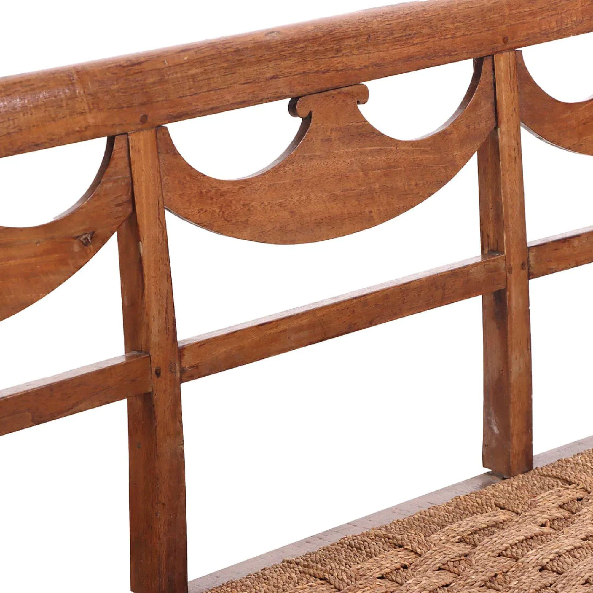 18th Century Italian Walnut Directoire Bench having a cord seat and open arms.  A beautifully preserved piece constructed of walnut, a prized material in Italy during the 18th century for its fine grain and warm tone.  A classic example of