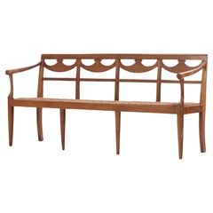 18th Century Italian Walnut Directoire Bench Having a Cord Seat and Open Arms