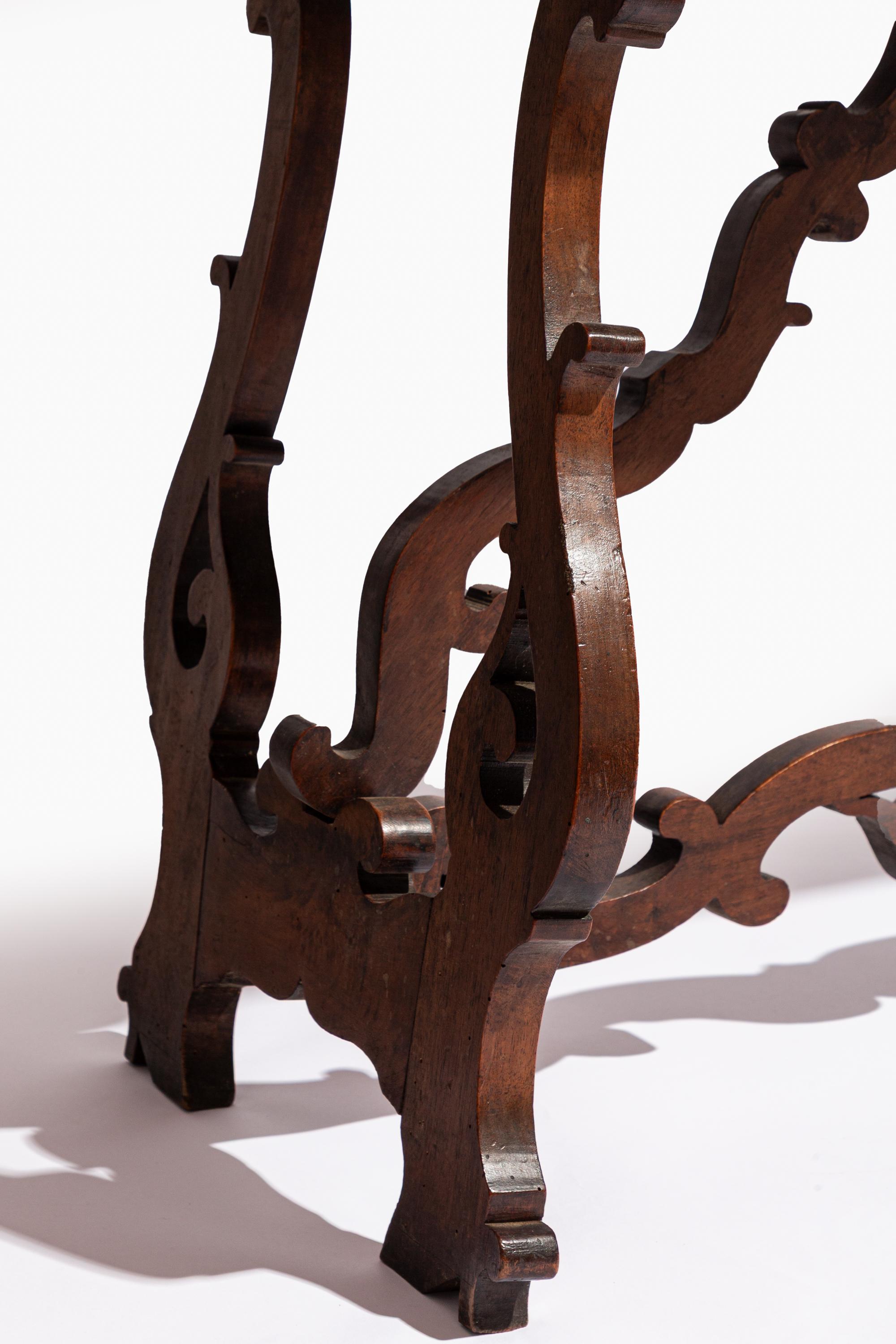 18th Century Italian Fratino table with lyre shaped legs and scrolling stretchers.

Solid construction with lovely overall patina.