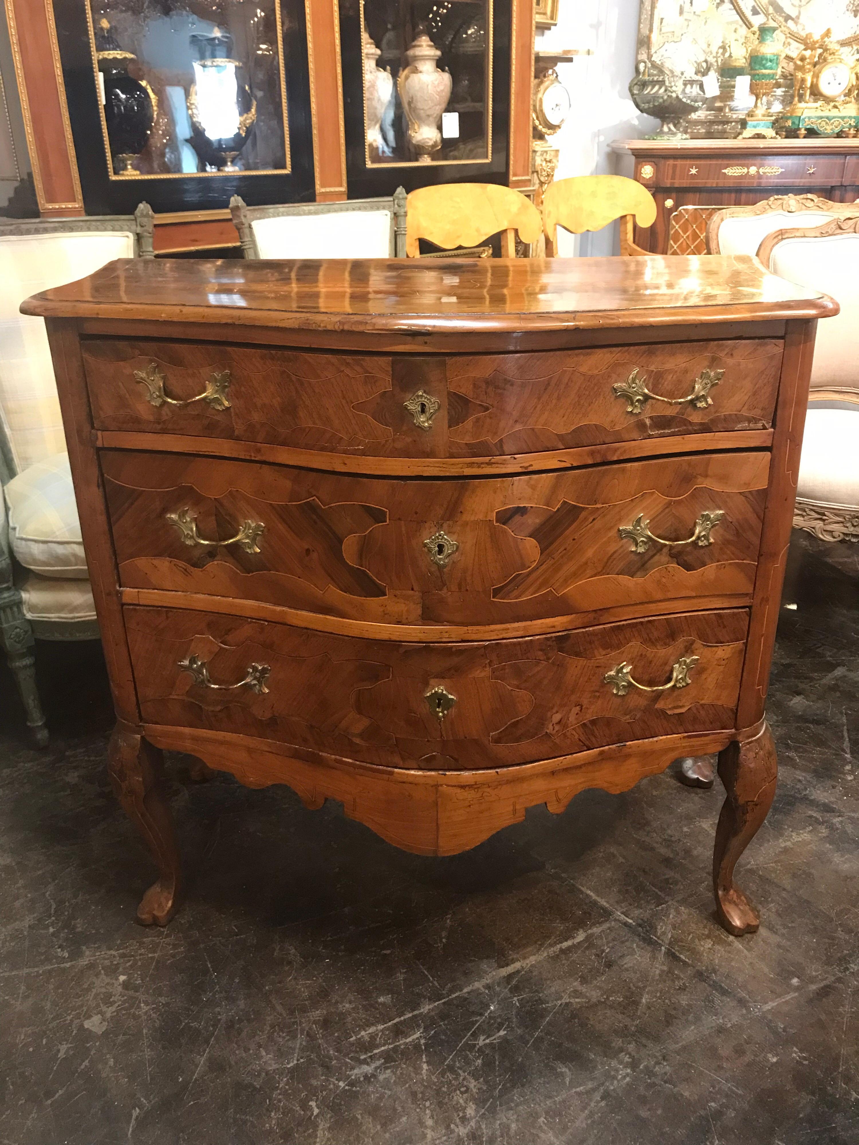Handsome 18th century Italian inlaid walnut commode. Having 2 drawers raised above 2 curved legs. Very well made with rich old patina and charm. Extremely well priced for an 18th century piece!