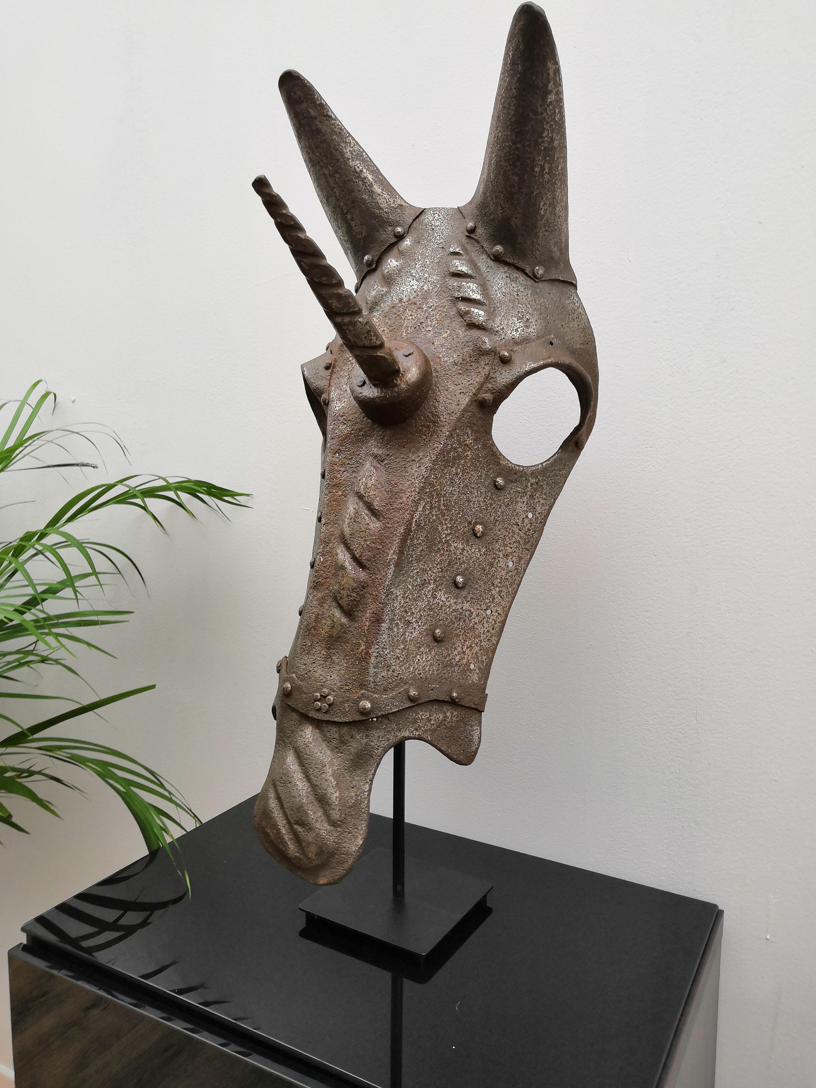 Authentic chanfron or horse armour face mask, dated circa late 18th-early mid-19th century from Northern Italy in wrought iron. 

During the late Middle Ages as armour protection for knights became more effective, their mounts became targets so