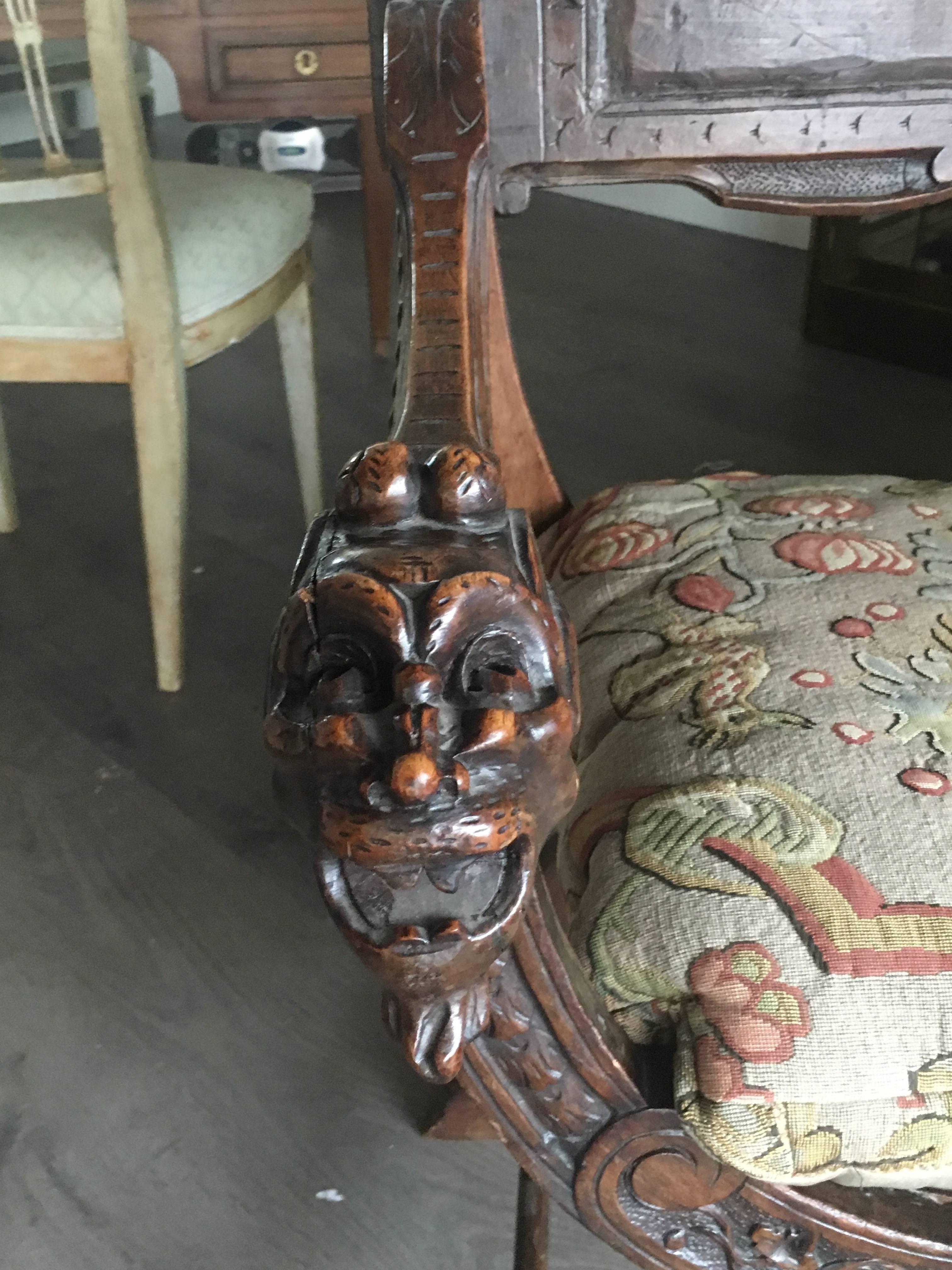 18th century Italian X-form chair with wonderful detailed carving and patina.