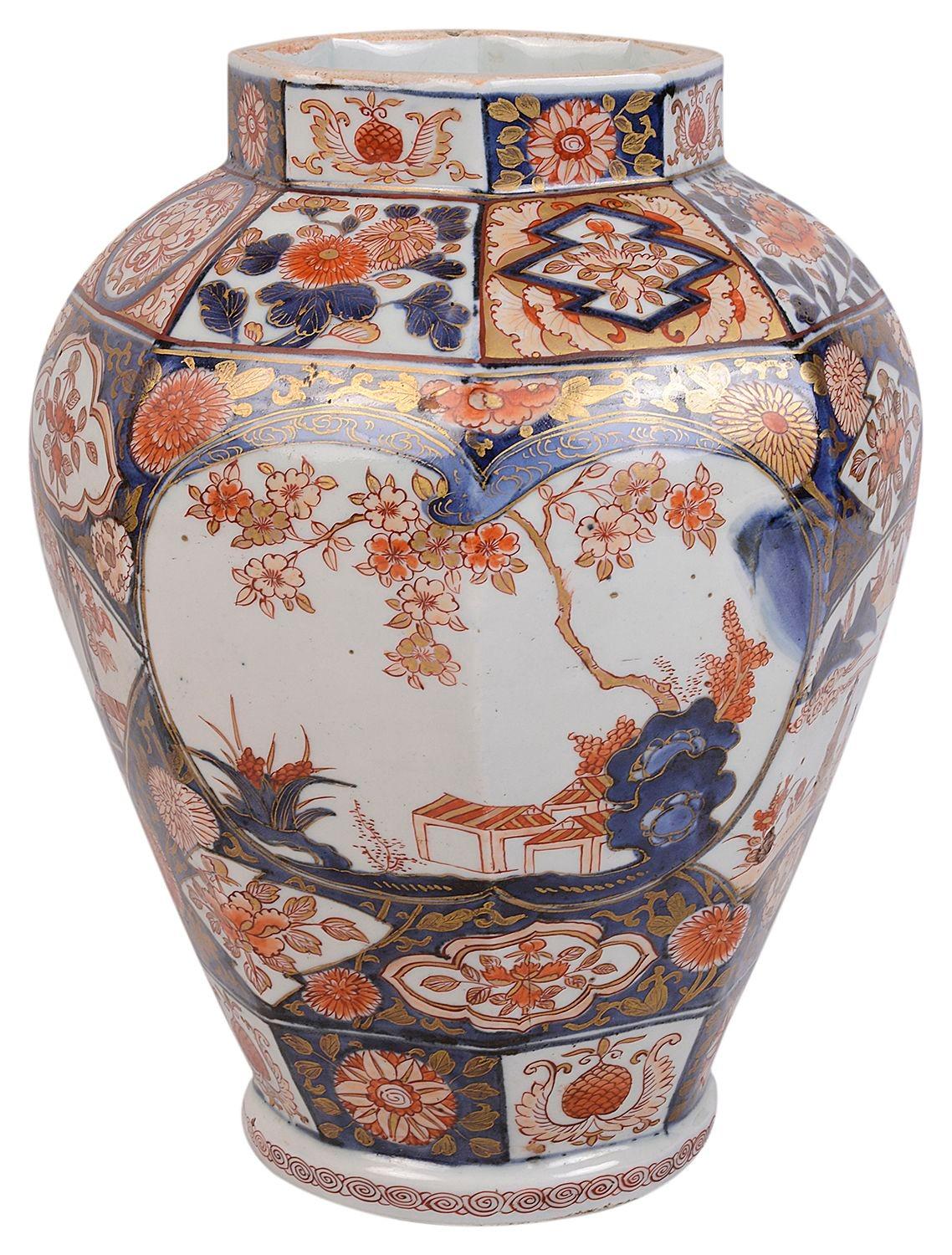 A good quality 18th Century Japanese Arita Imari porcelain vase / lamp. Having wonderful bold colouring to the classical motif decoration to the boarders, inset painted panels depicting blossom trees and people in mountainous setting. 
Conversion to